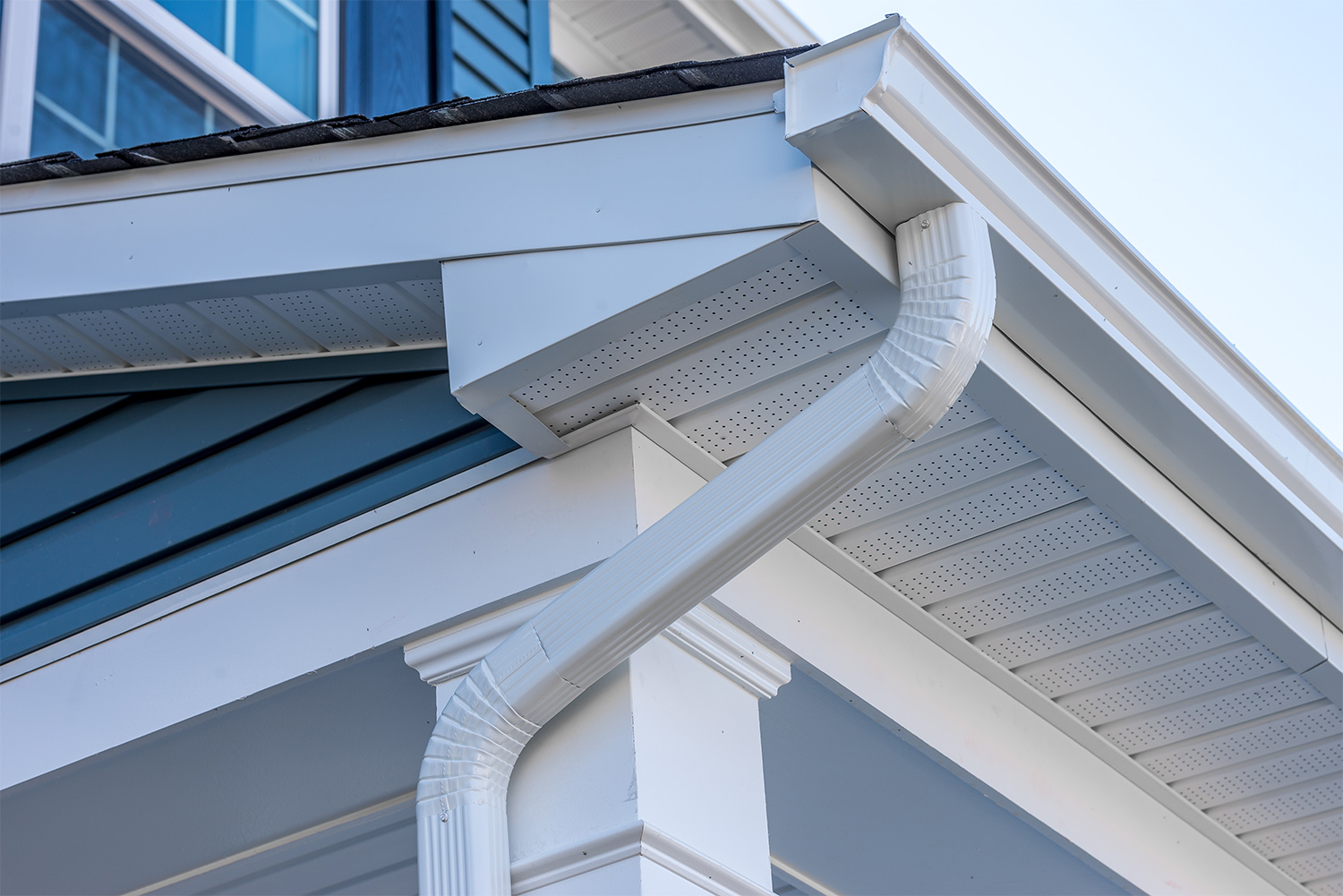 Close up of white gutters on a home