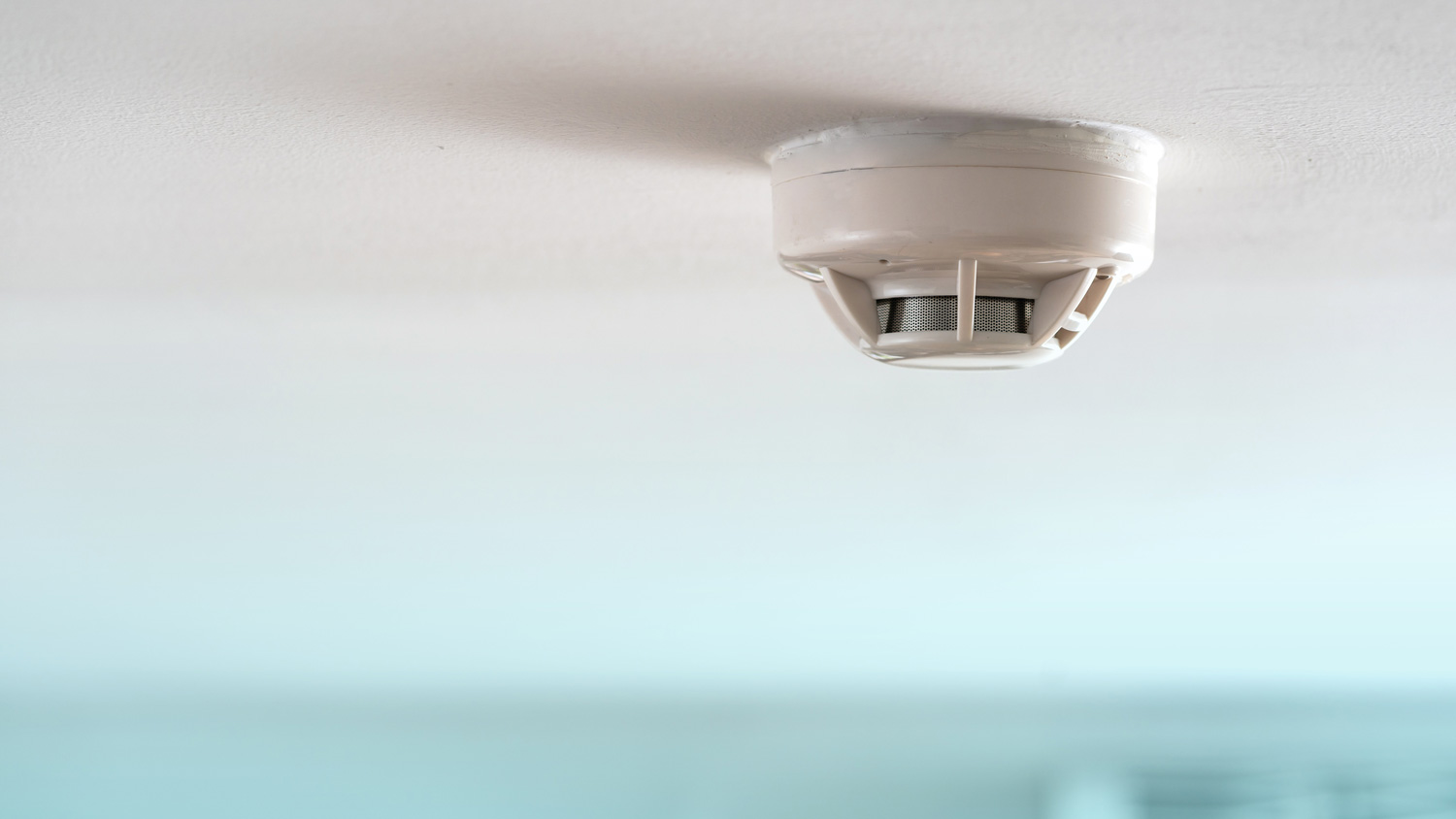 close up of smoke detector in home