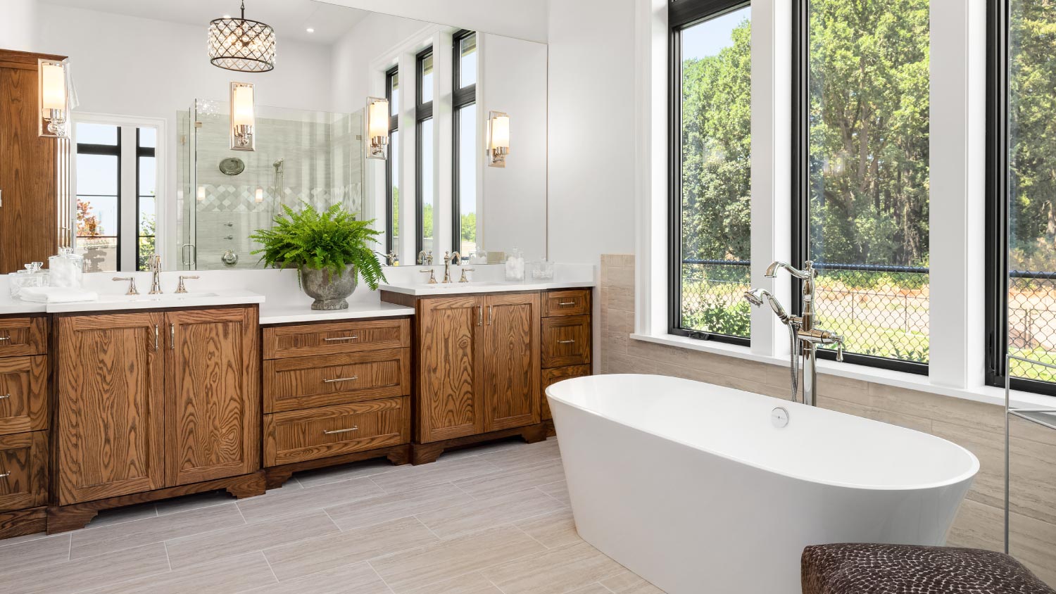 Bathroom with double vanity and bathtub