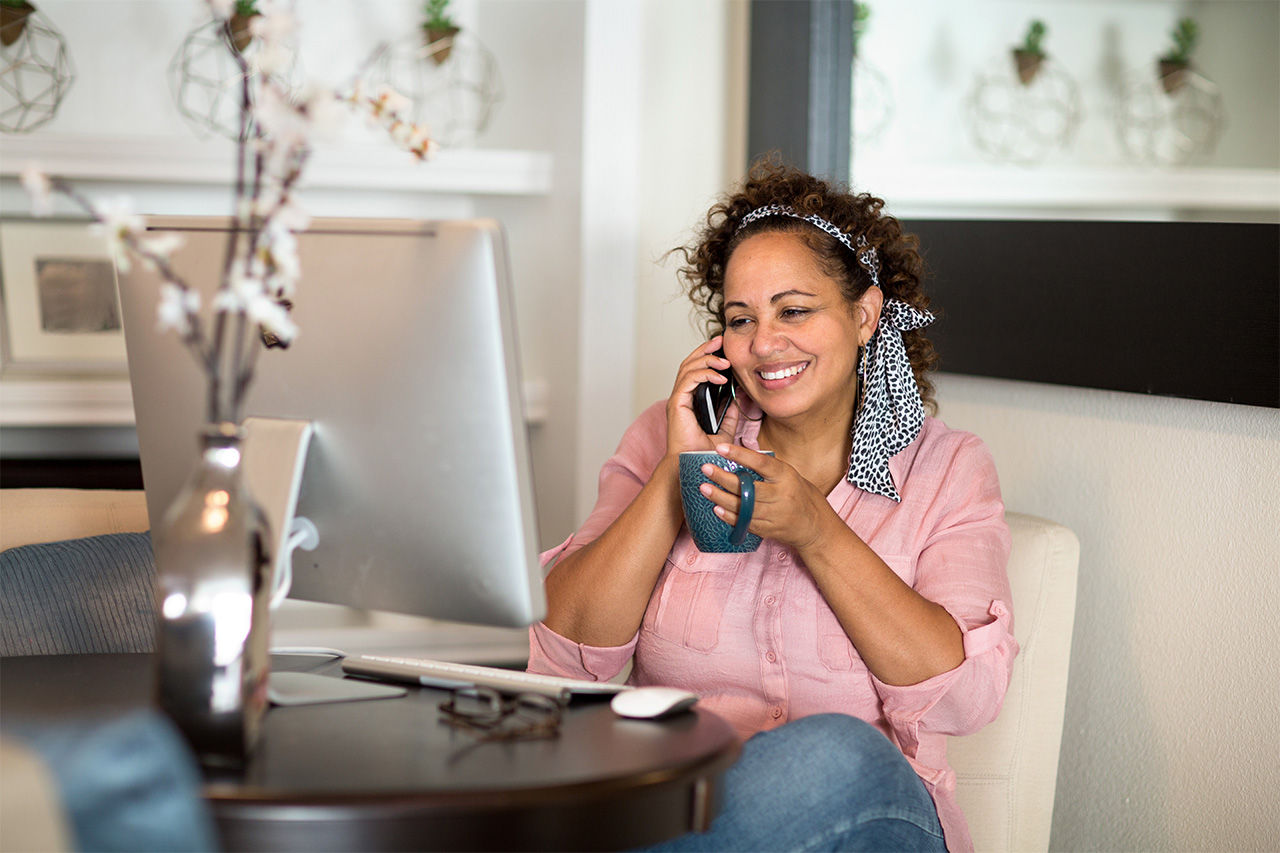 woman talking on house phone