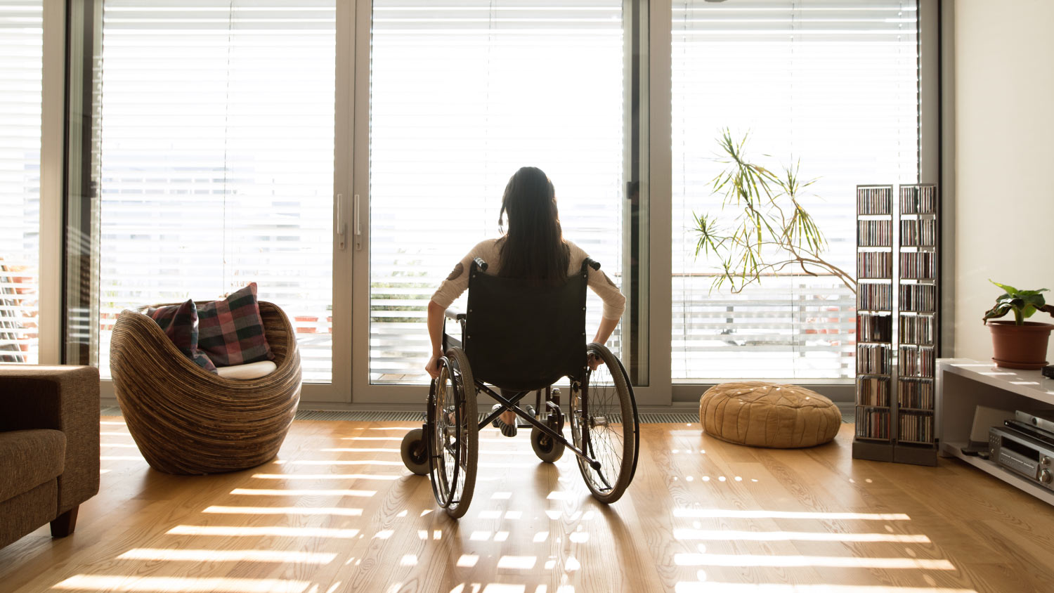 woman wheelchair in bright living room