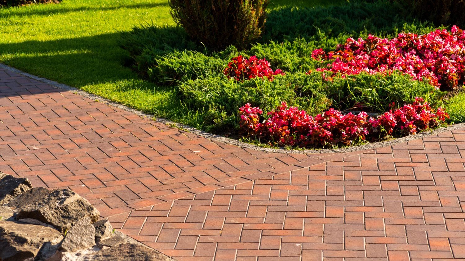 Interlocking red brick pavers on a walkway