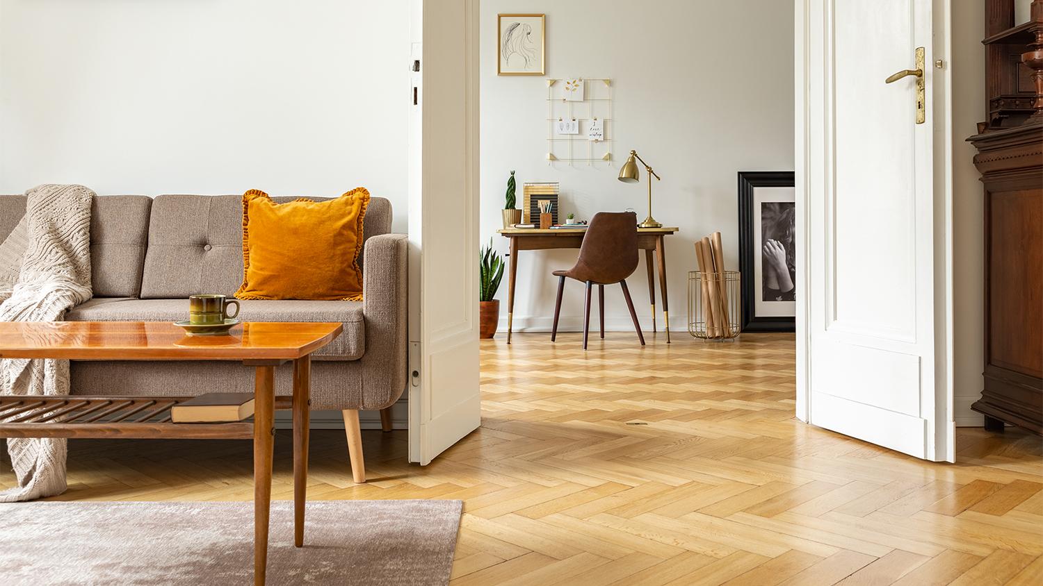 living room and office space with parquet flooring