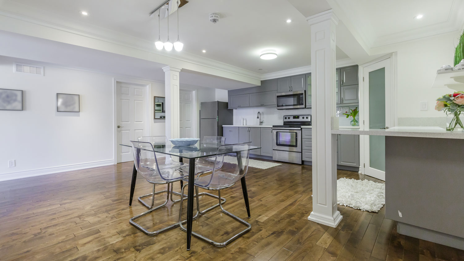 An open-plan kitchen in the basement of a house