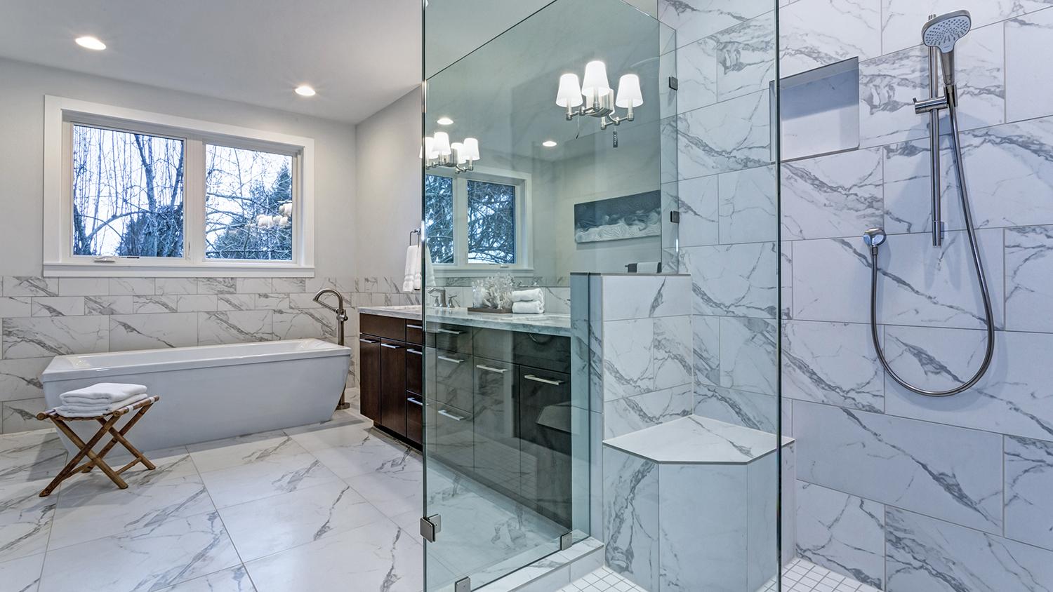 large marble bathroom with shower and tub