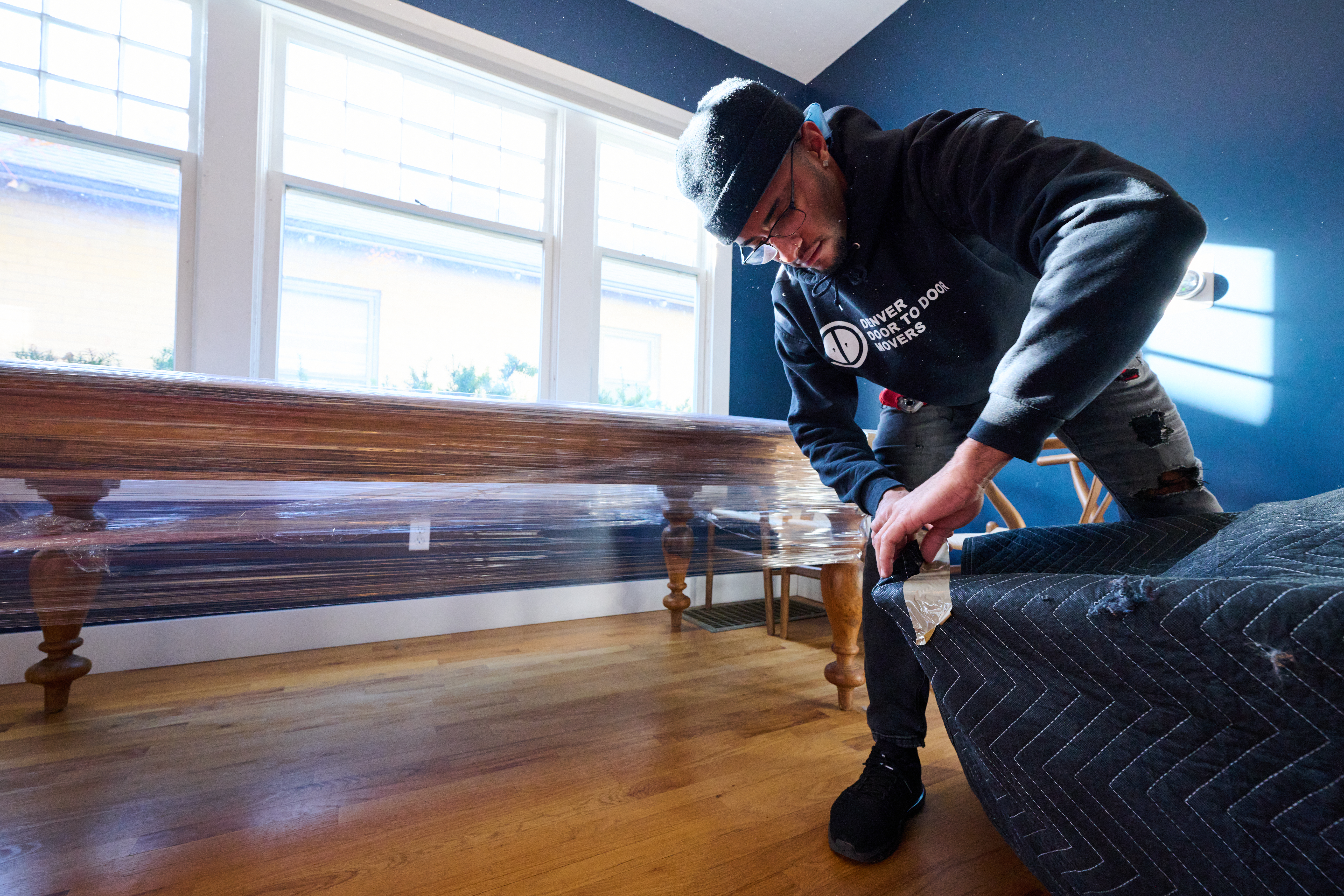 Mover packing up furniture