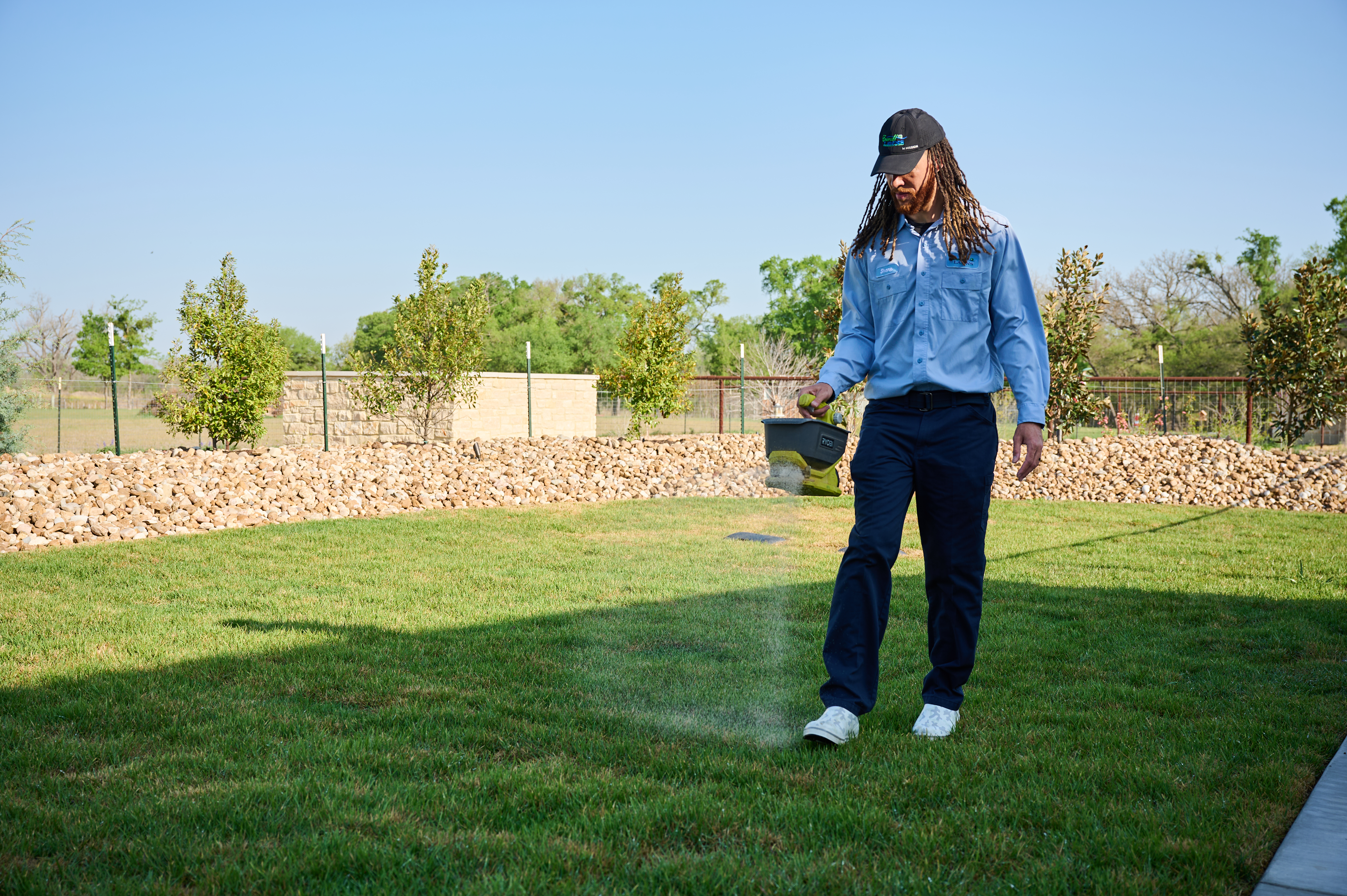 Man seeding fresh lawn.