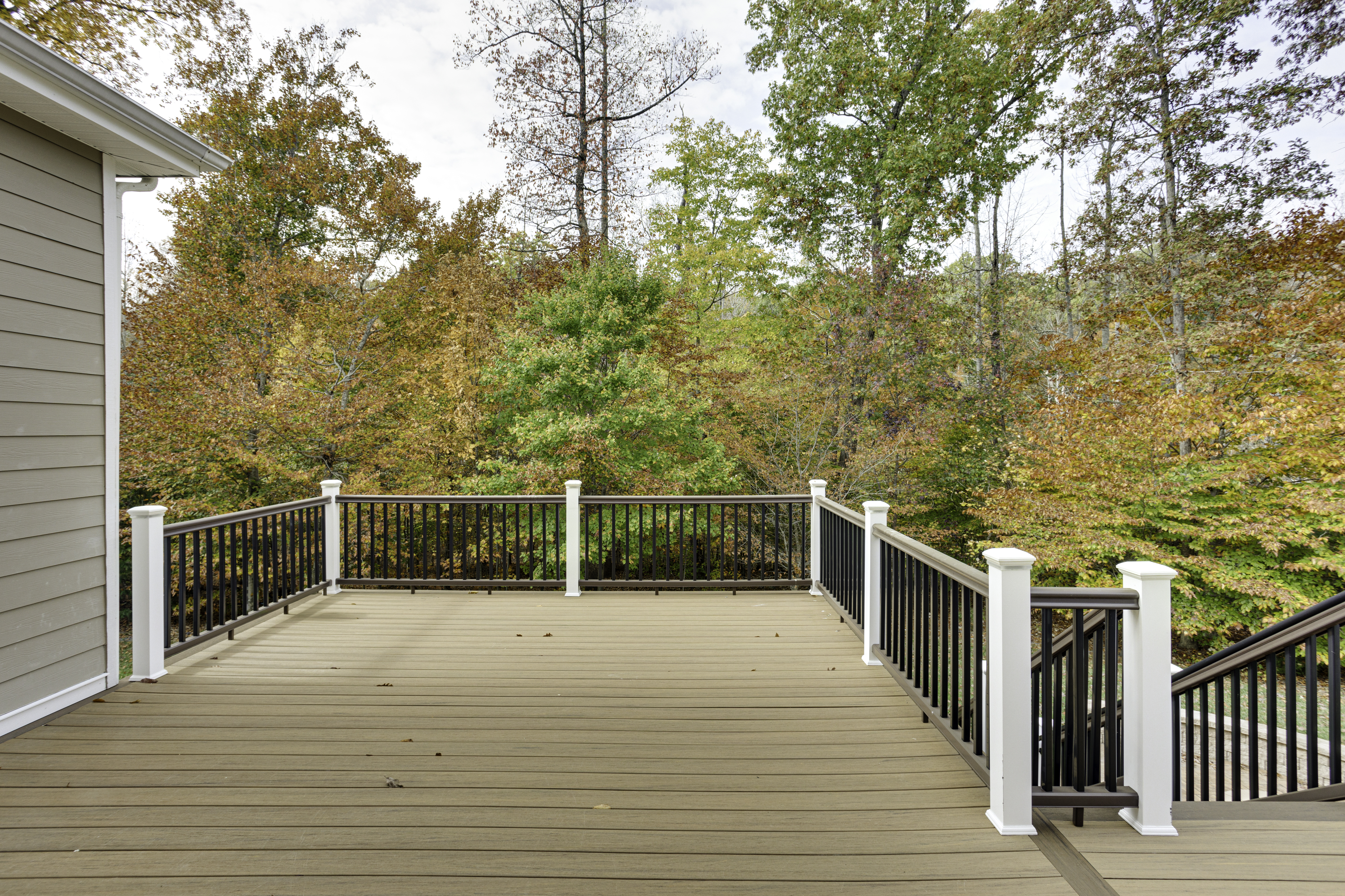 Composite railing installed on a large backyard deck