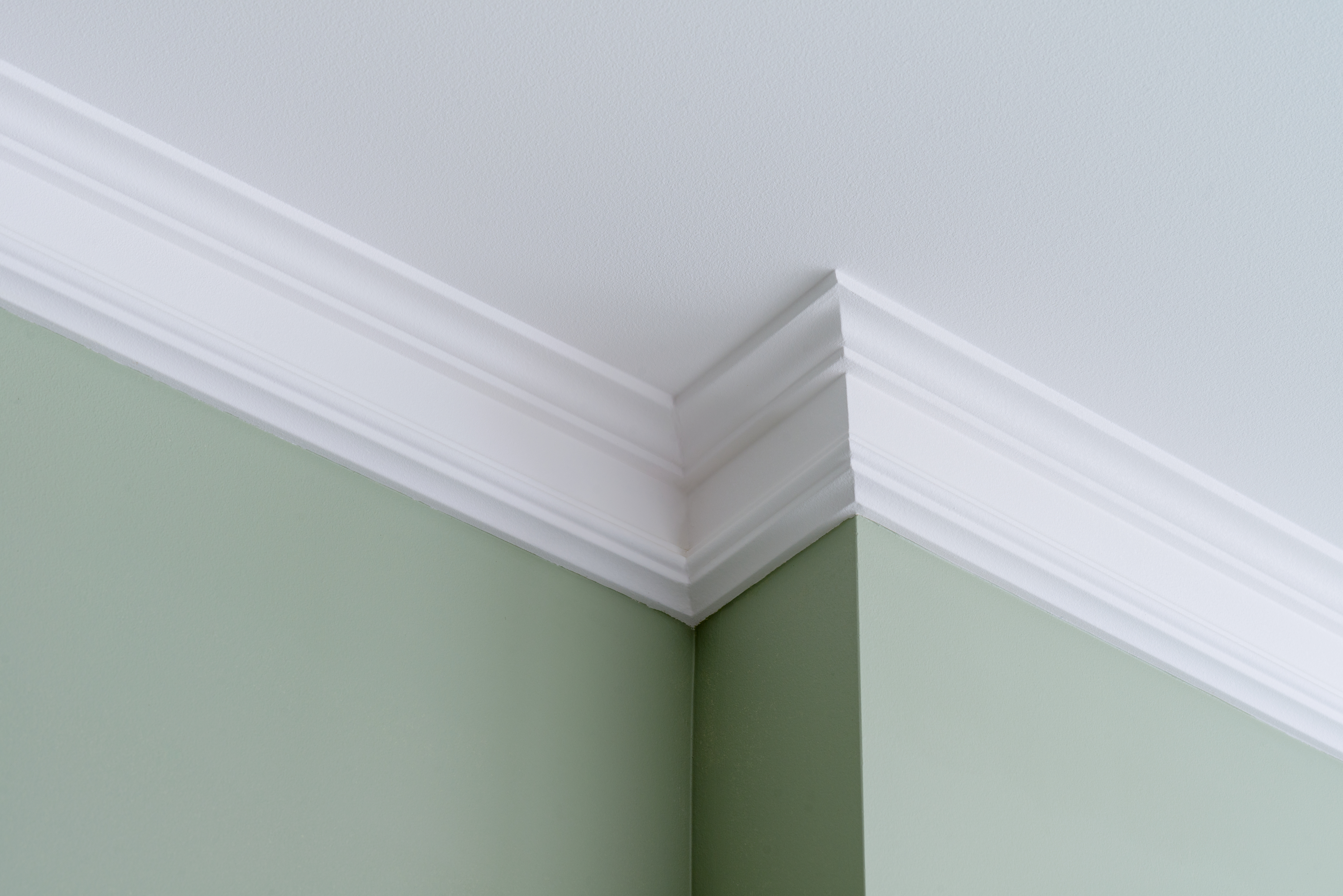 A crown molding in an intricate corner of the ceiling 