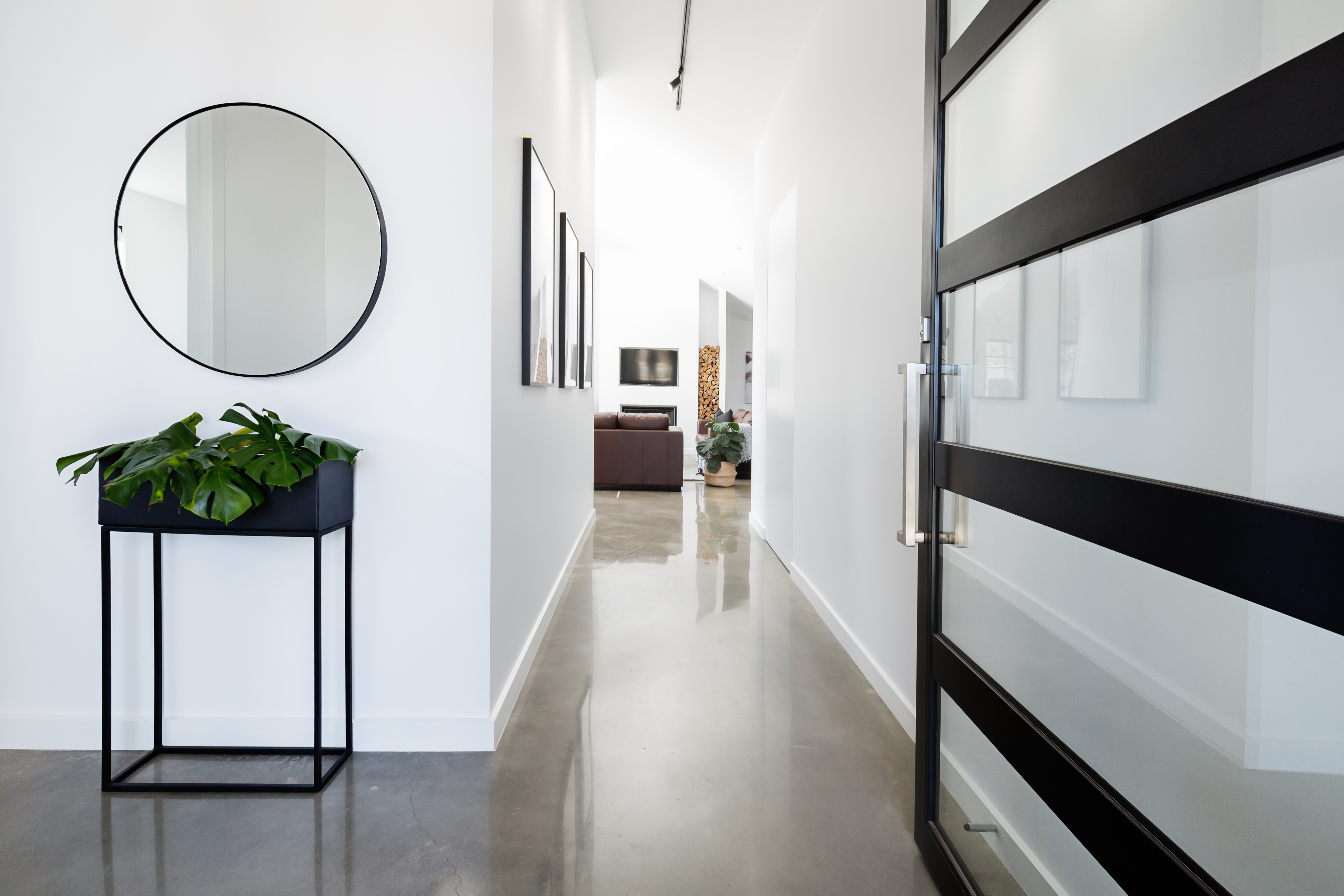 Contemporary home entryway with polished concrete floor