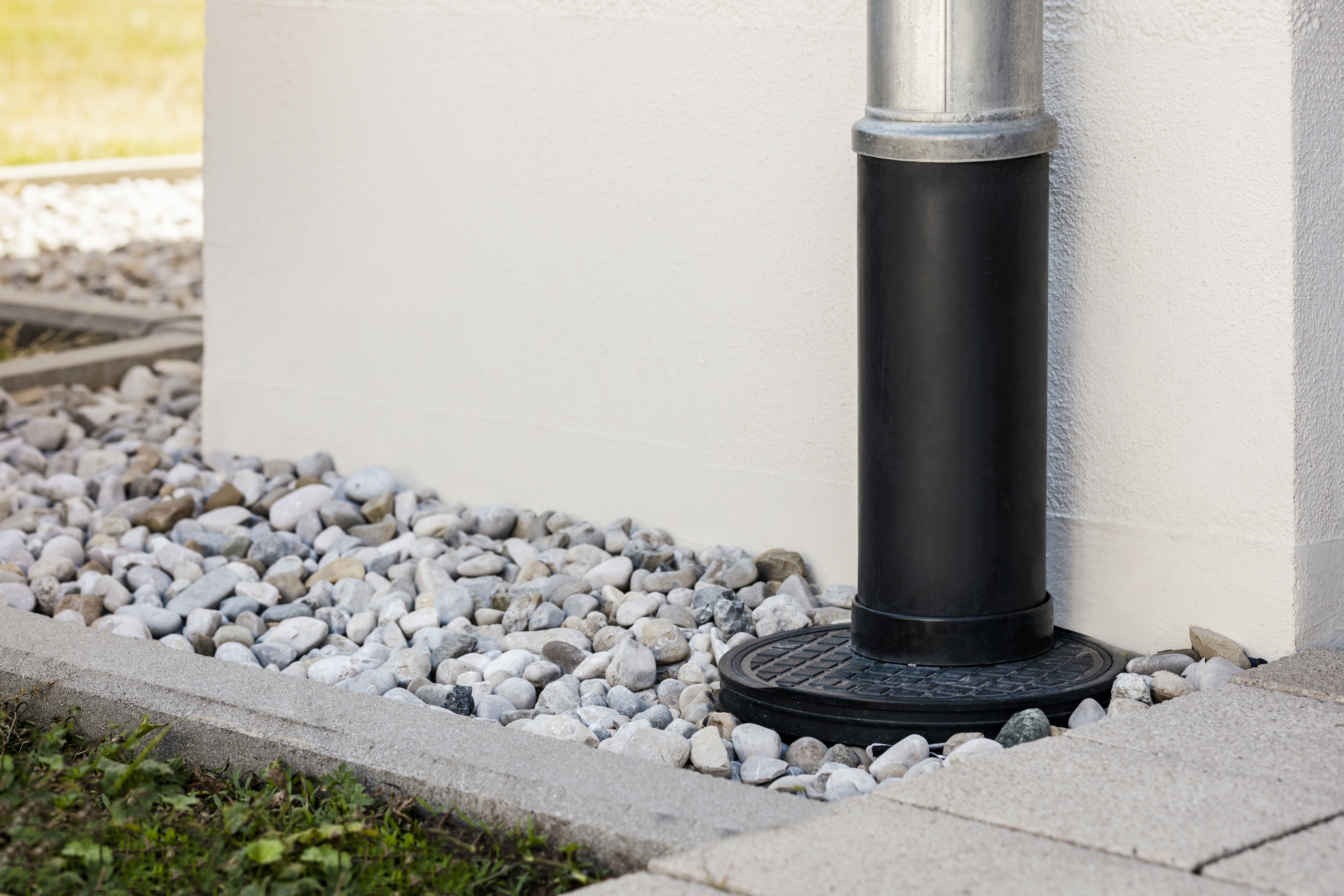 Gutter downspout and a French drain installed in the yard