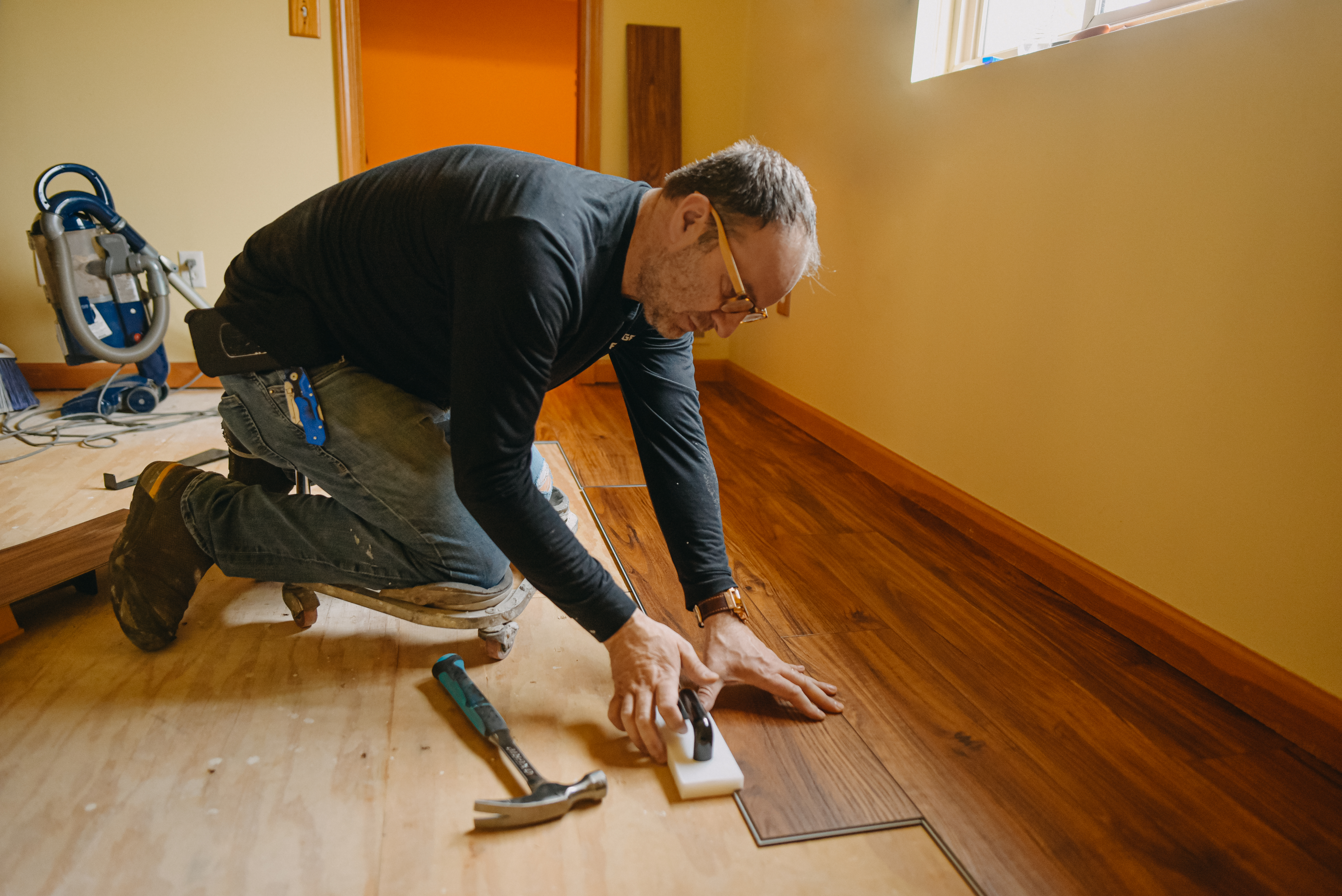 Man installing vinyl floor