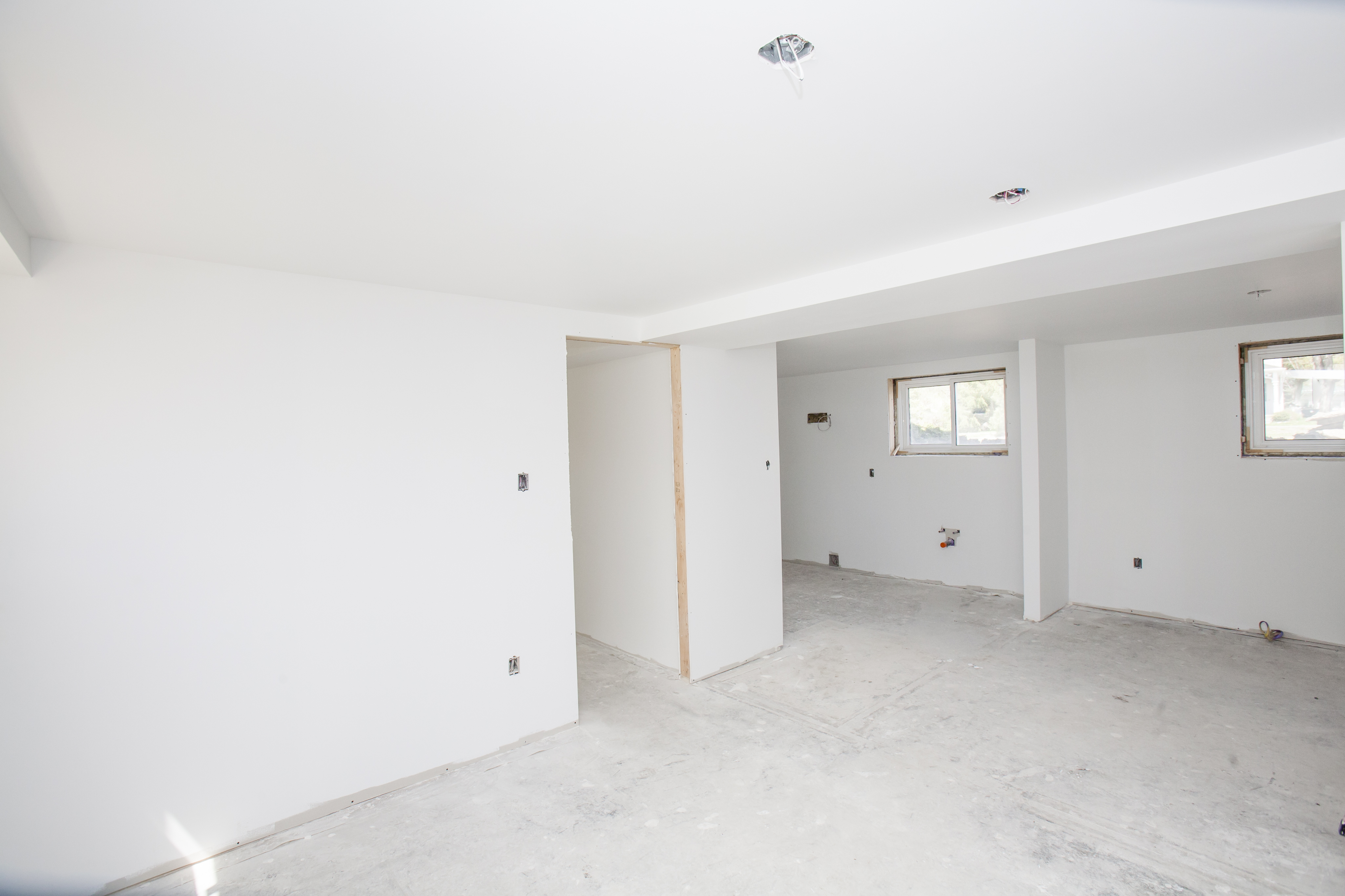 A large basement with drywalls