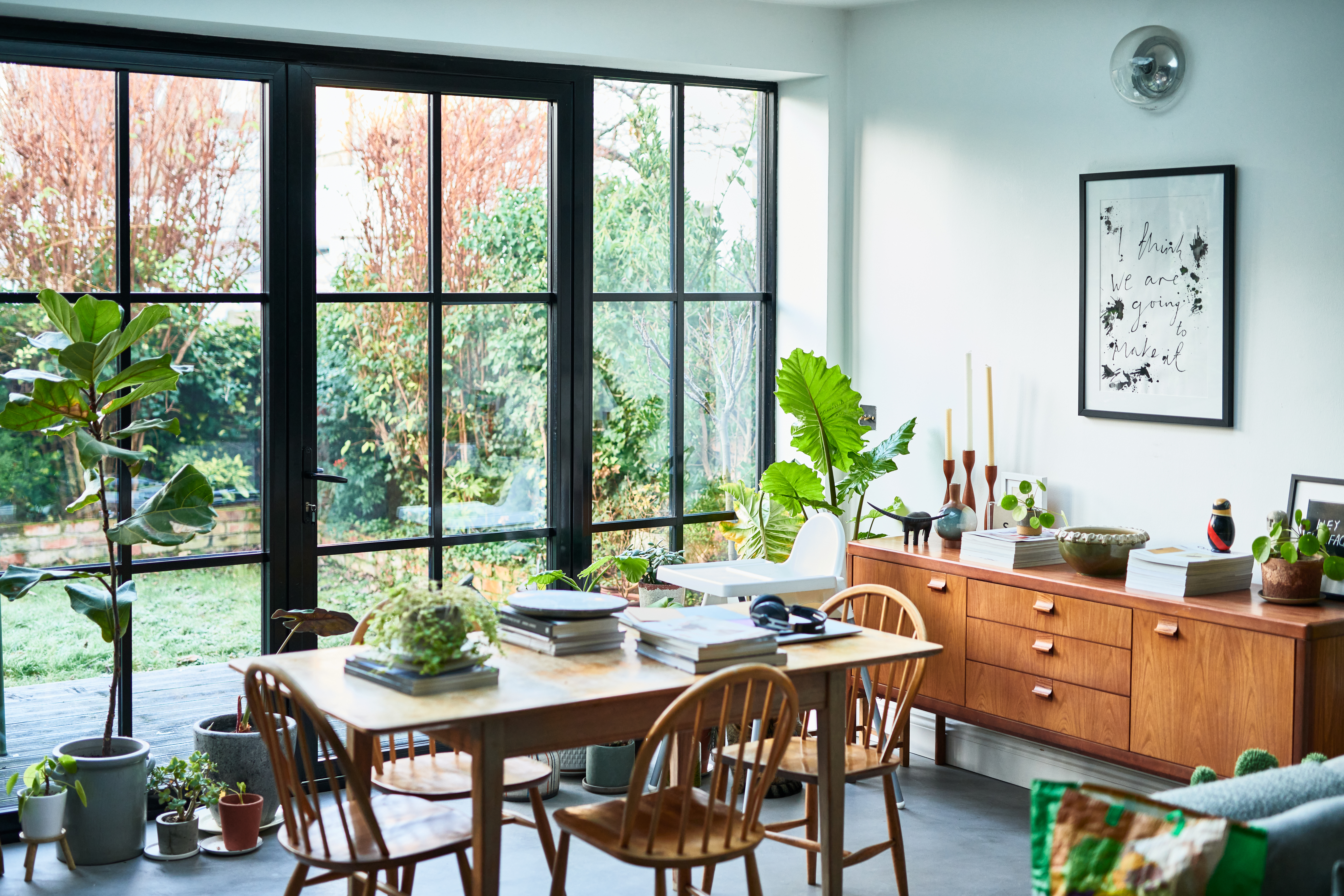 A bright living  room with houseplants 