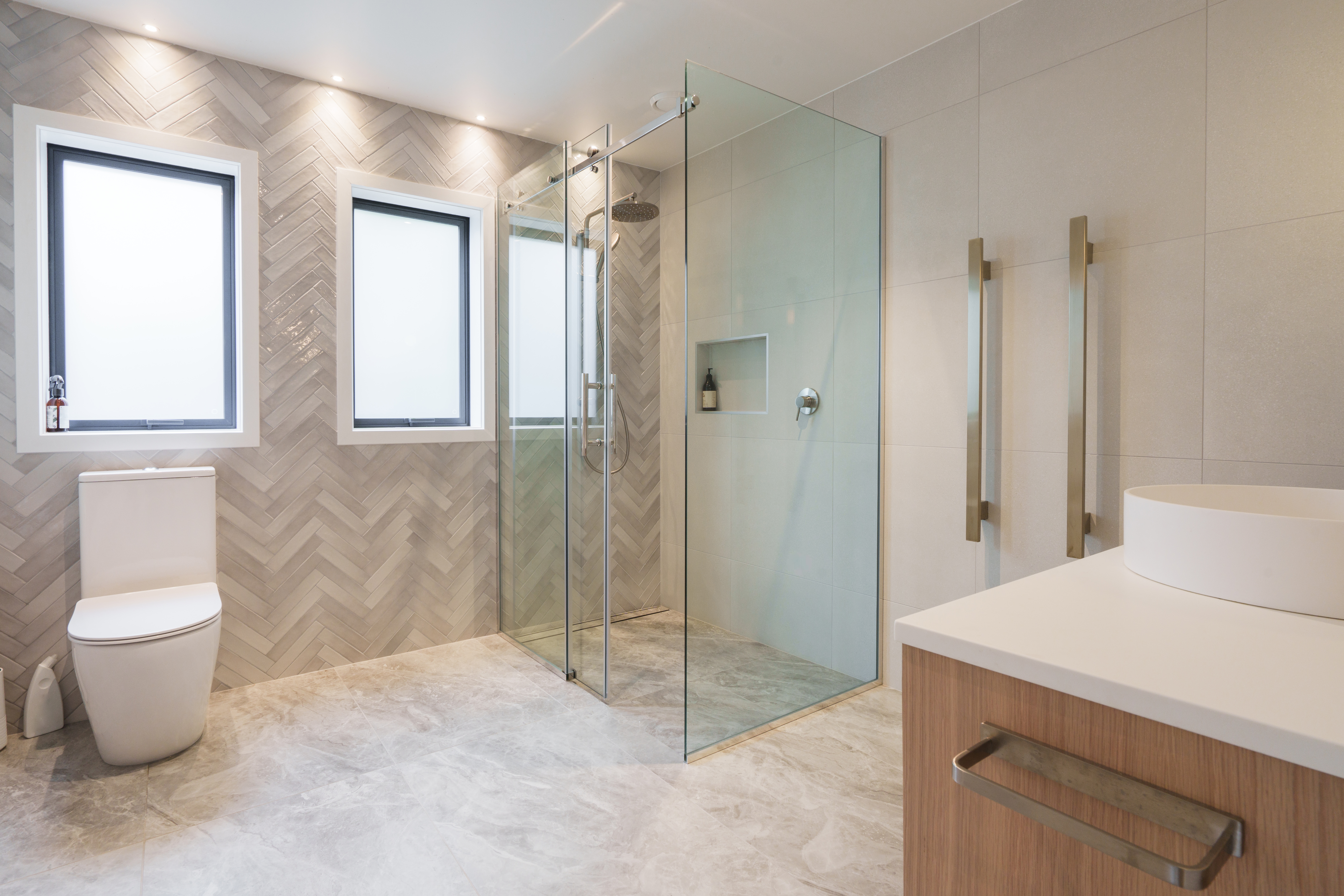 Shower stall with sliding doors installed in a large bathroom 