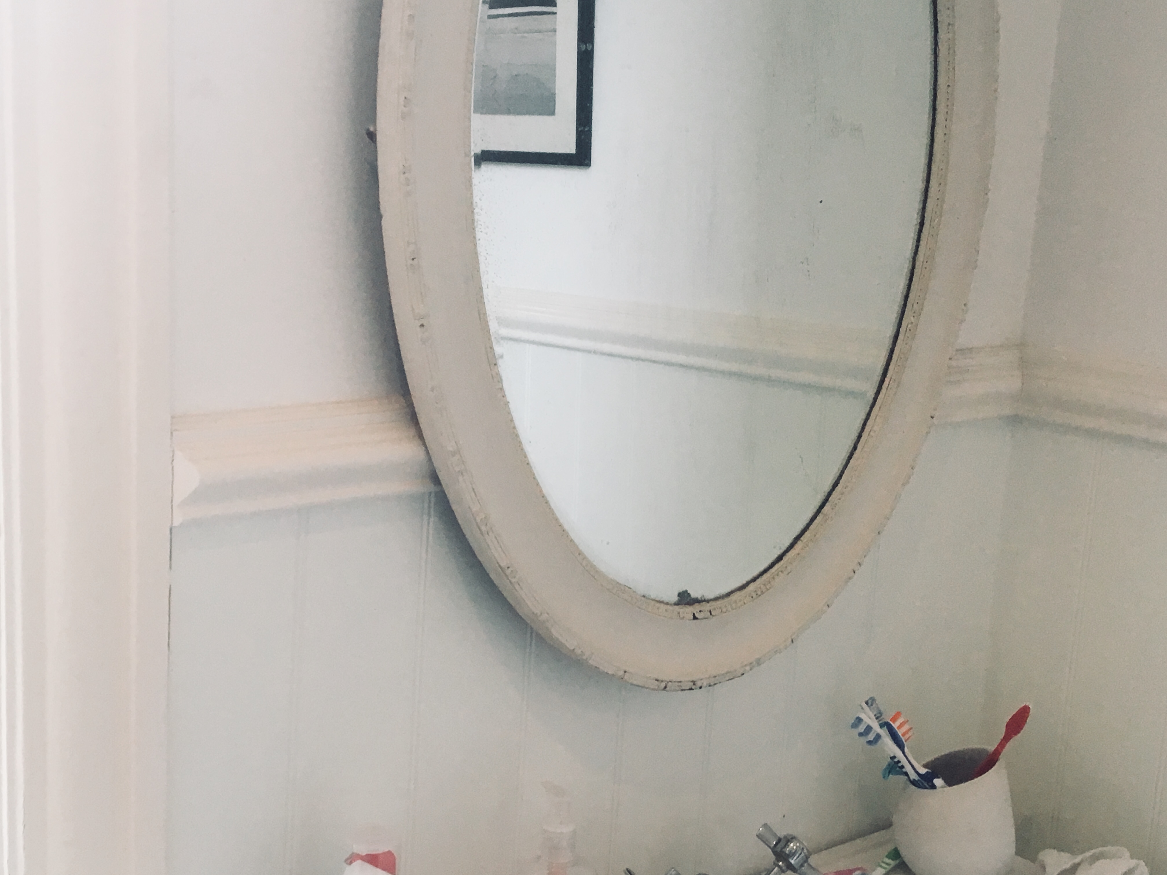 Mirror with sink and toothbrushes