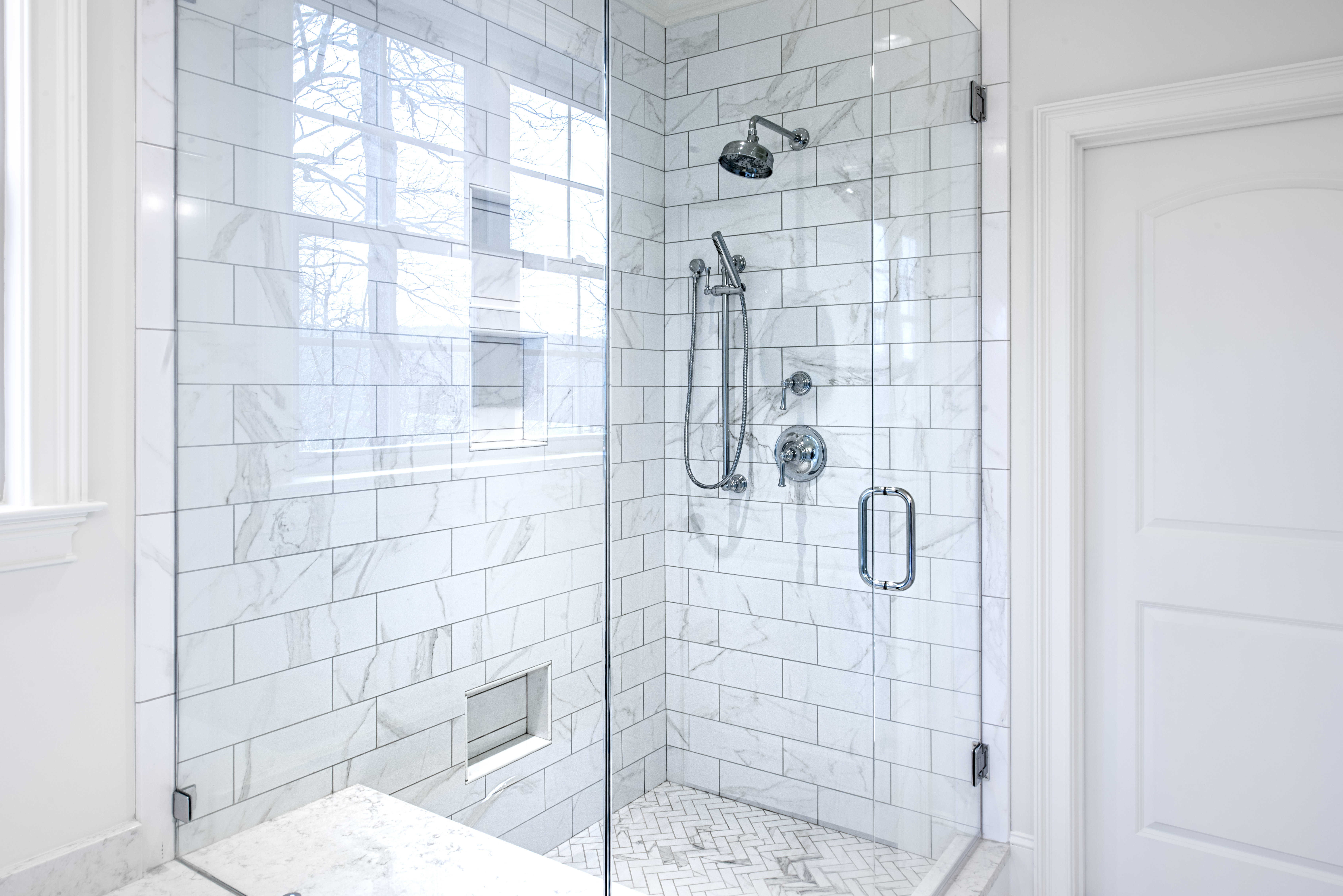Modern bathroom with glass door.