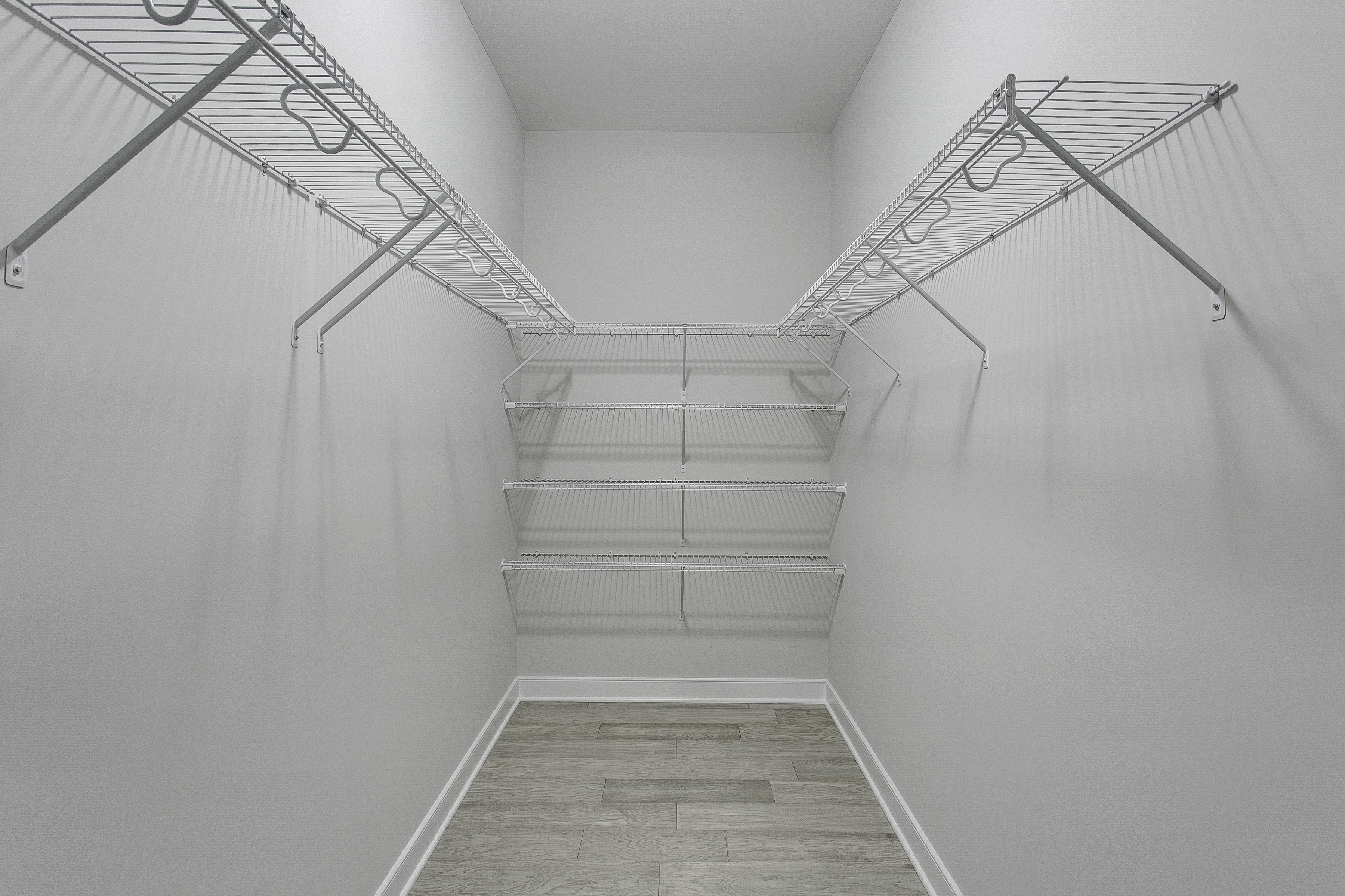 Closet with organized wire shelving units 