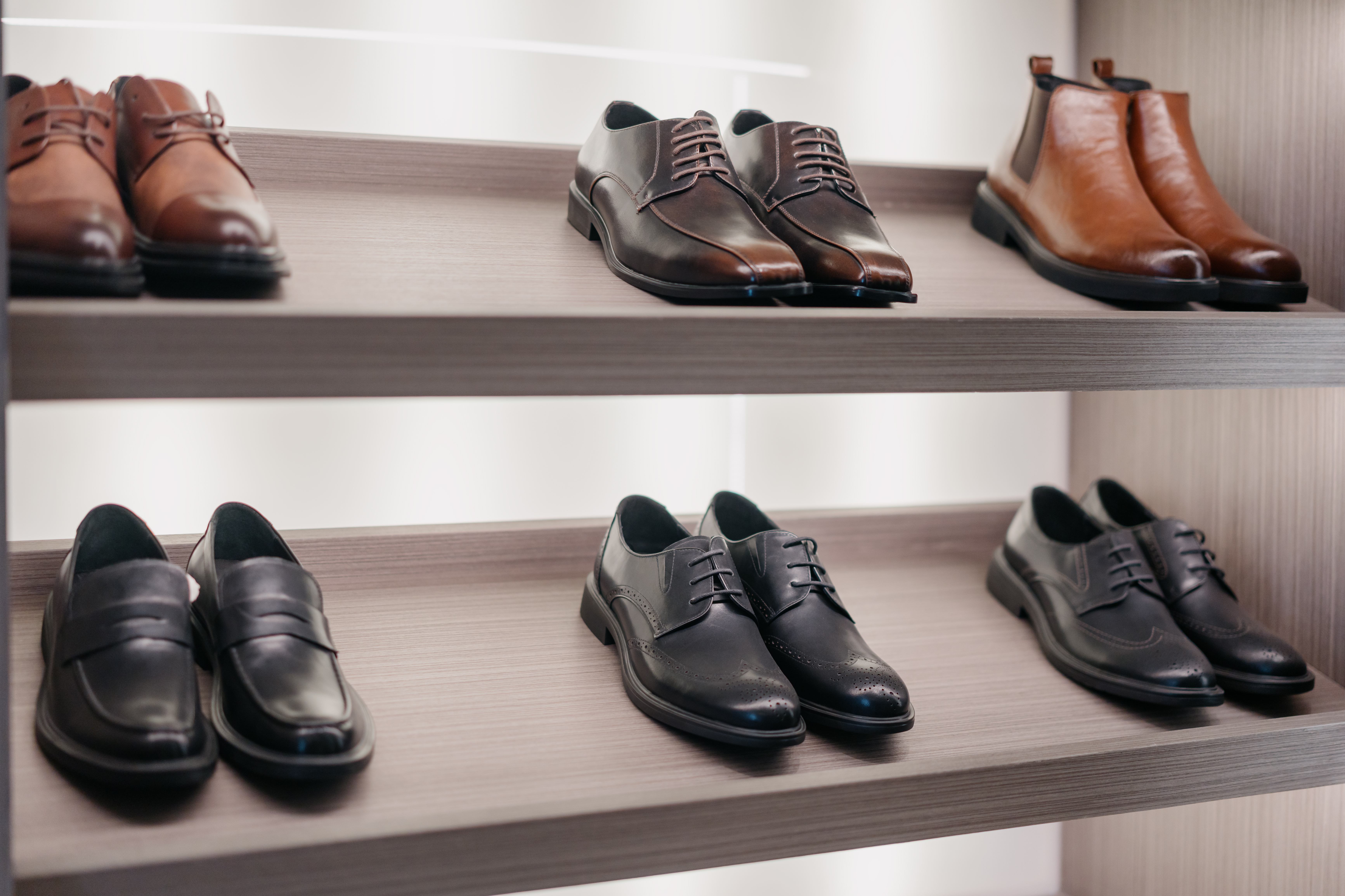  shoes on a wooden shelf 