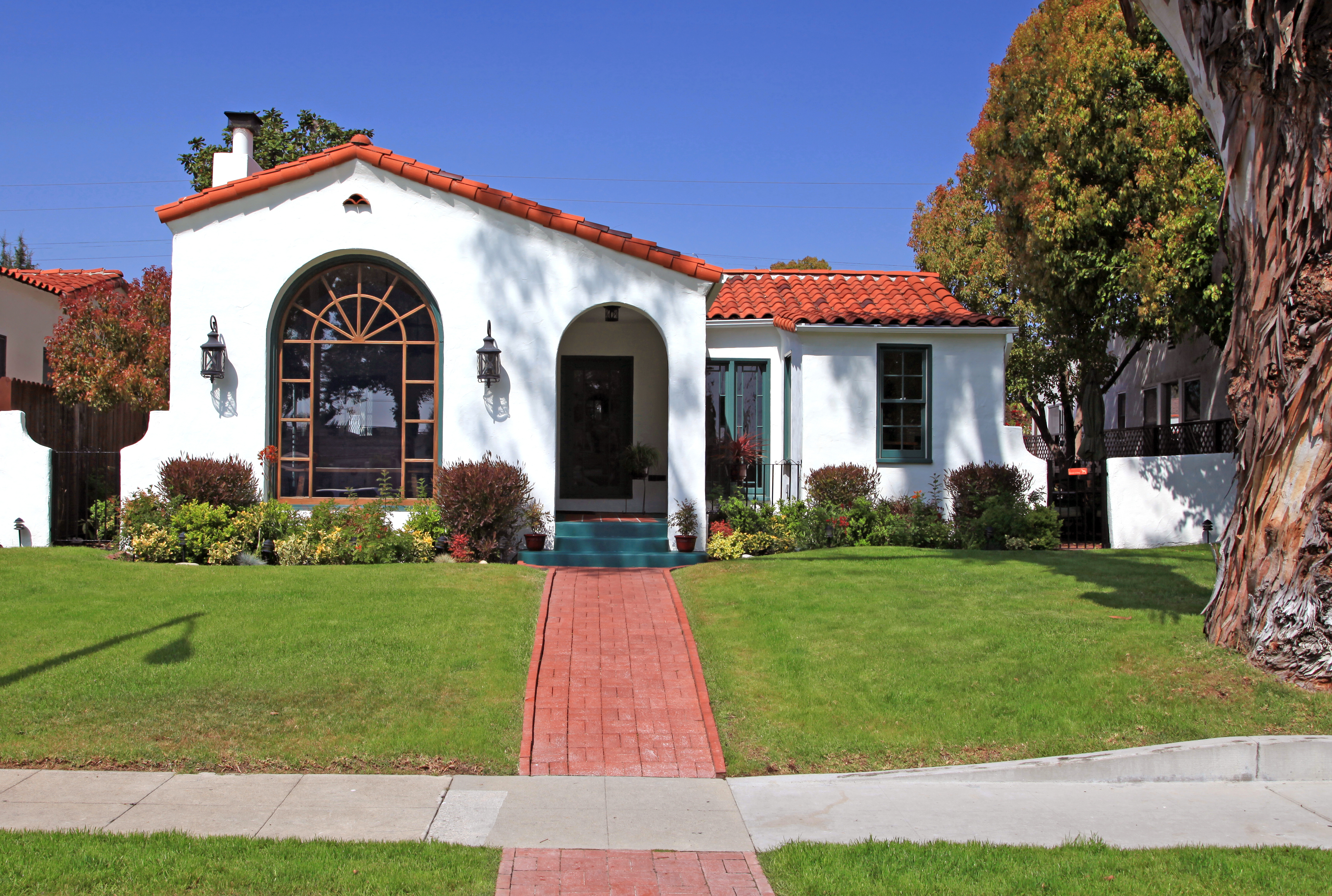 House with red tile roof on a sunny day