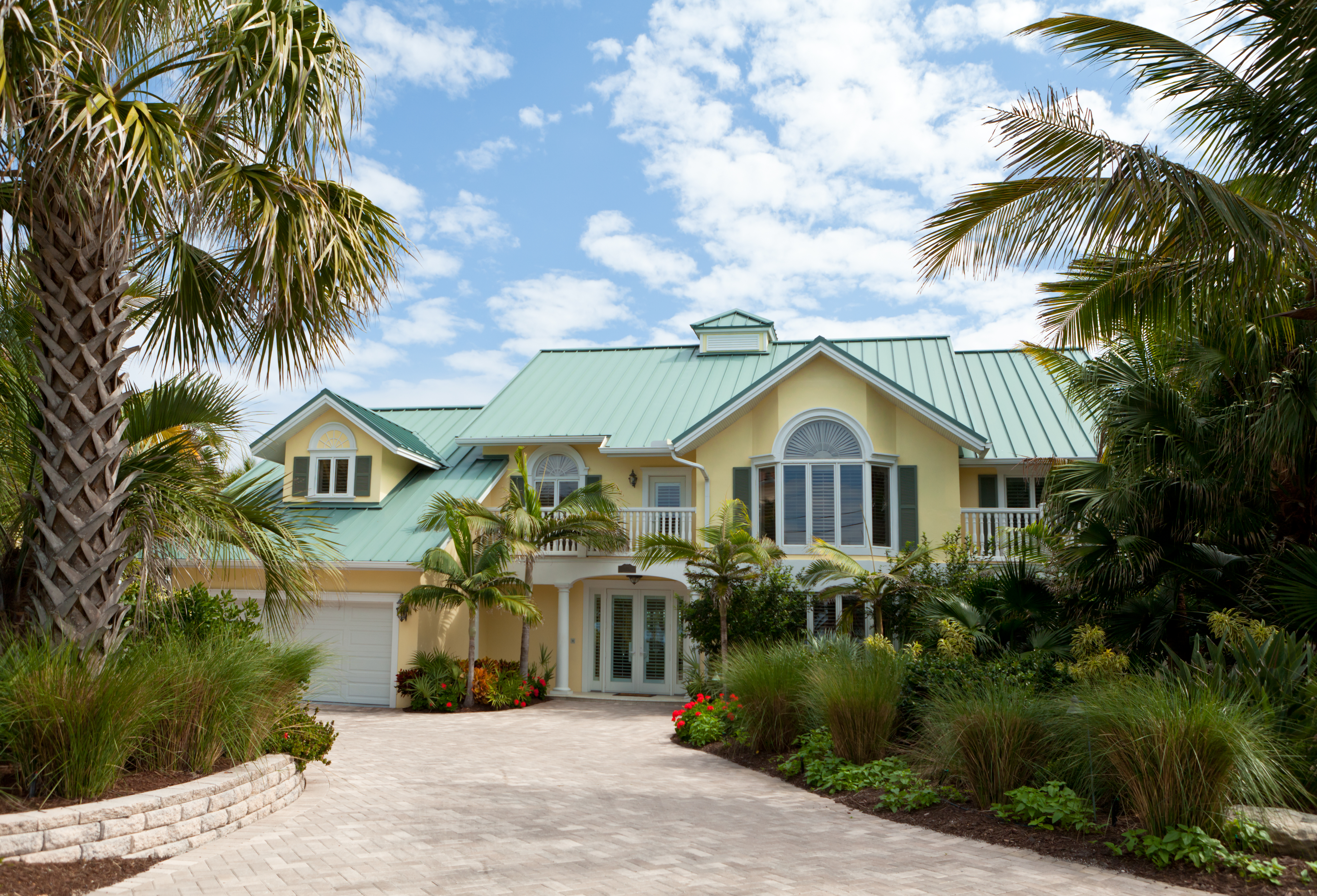 Yellow house with green metal roof in Florida  