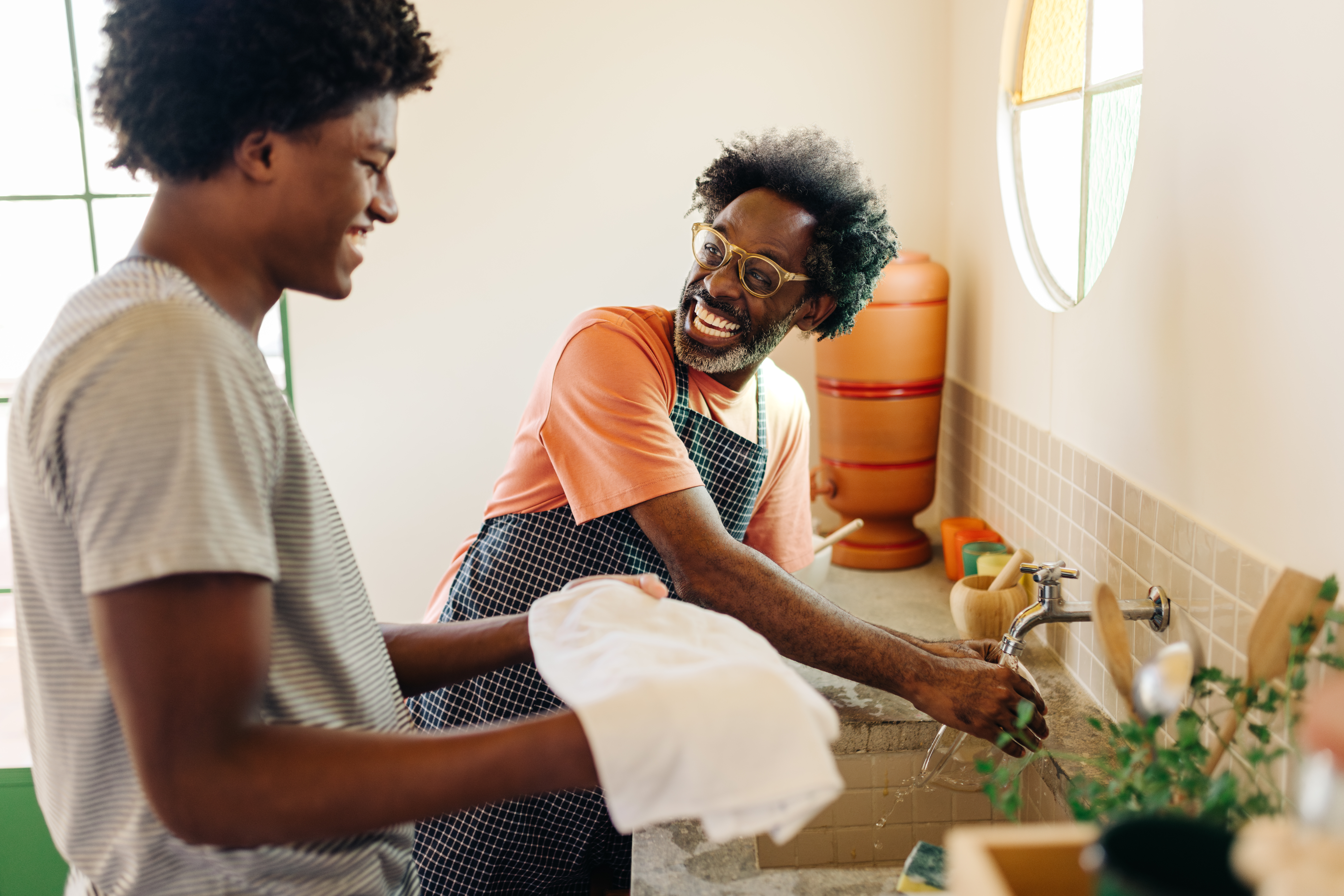 Father and son washing their hands 