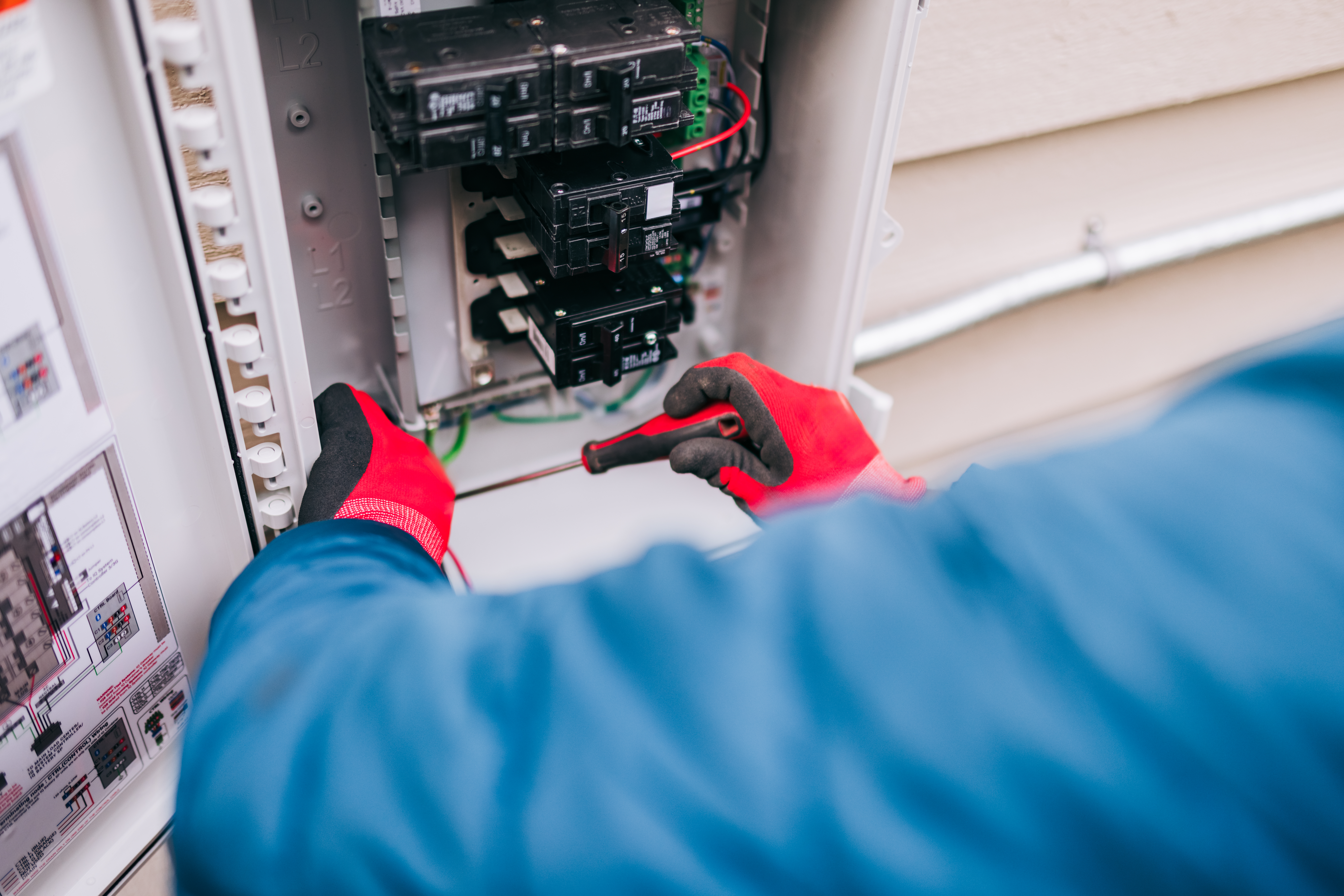 Man working on electrical panel 