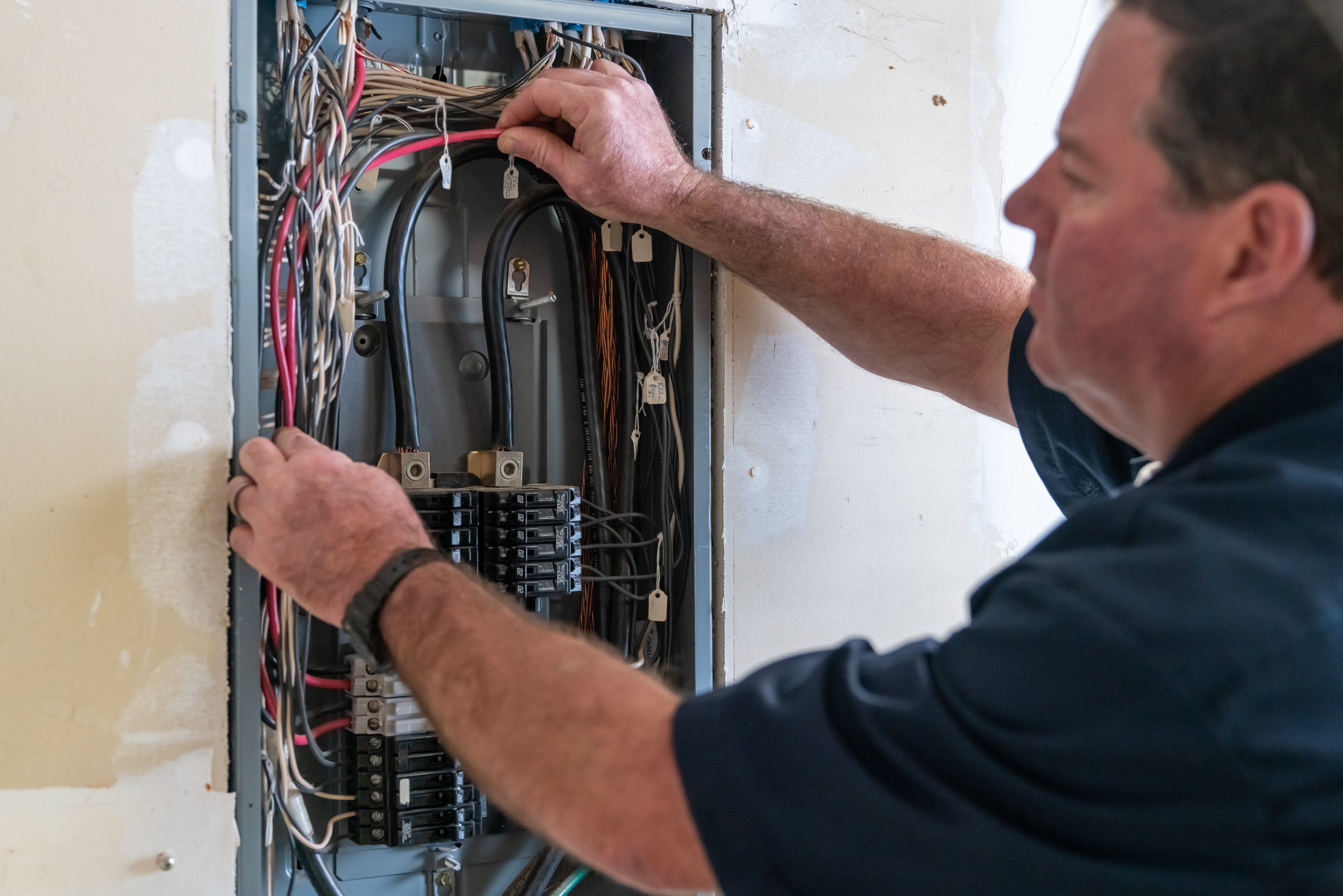 Electrician working on electrical box