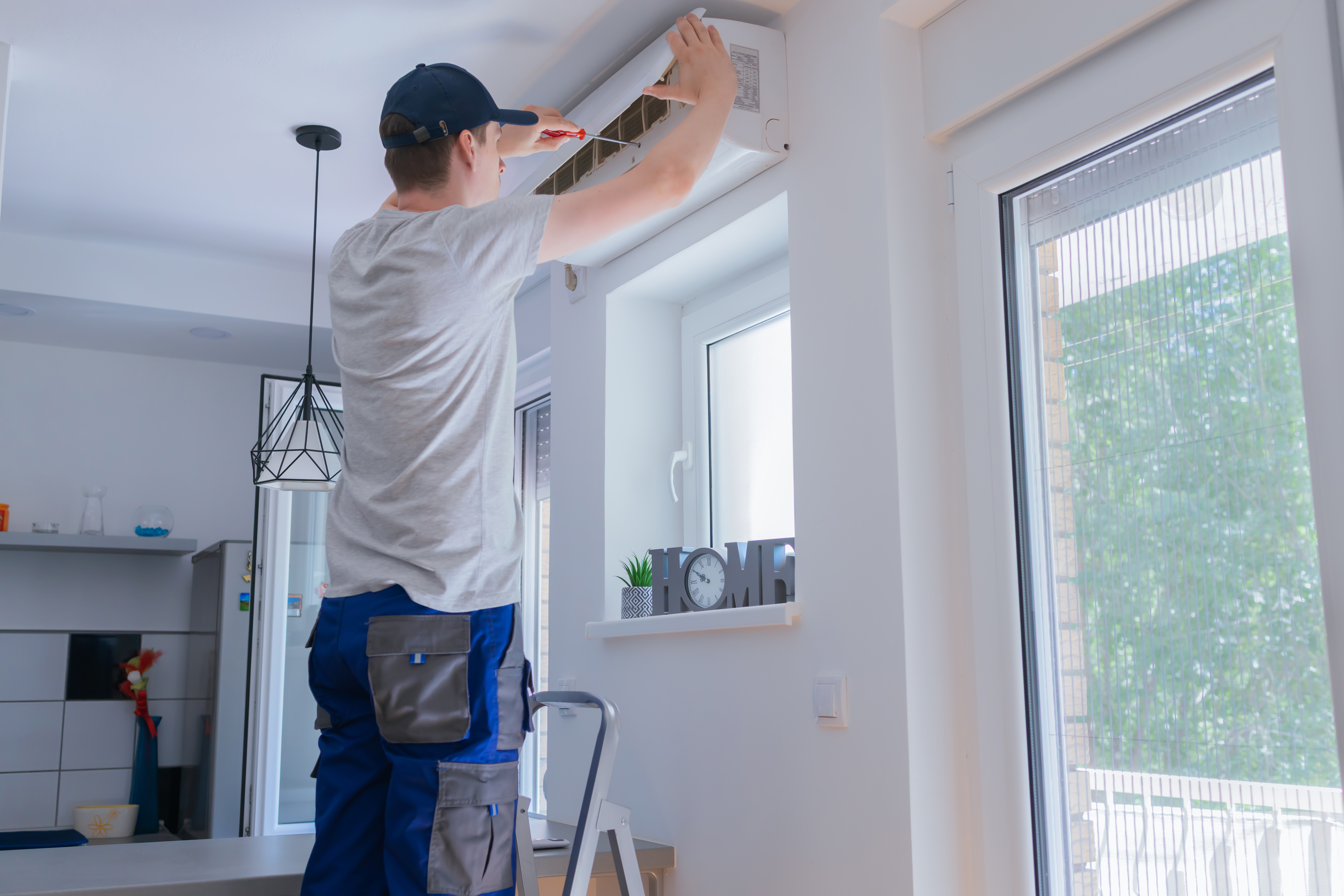 technician repairing ac