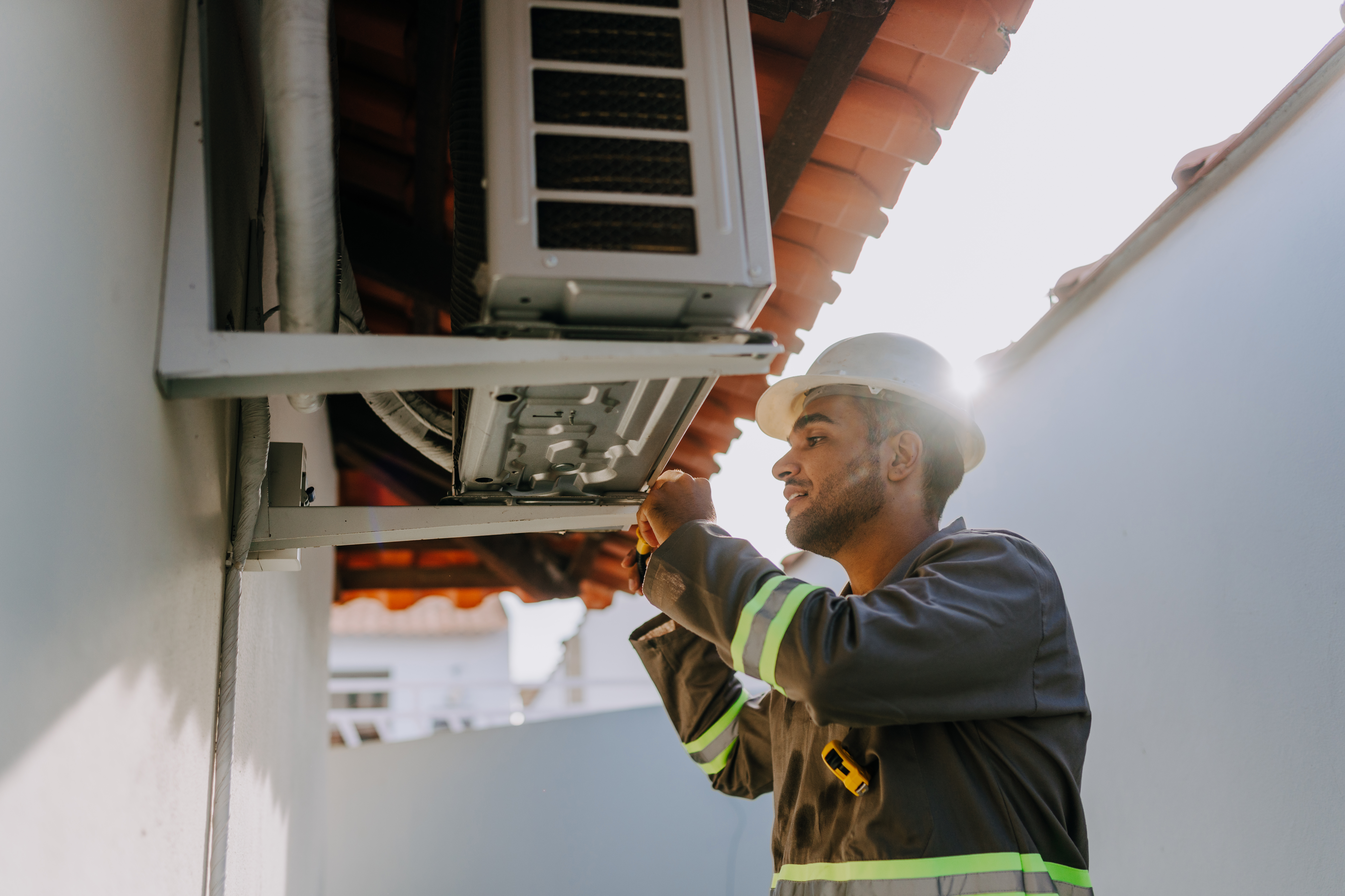 technician checking ac unit