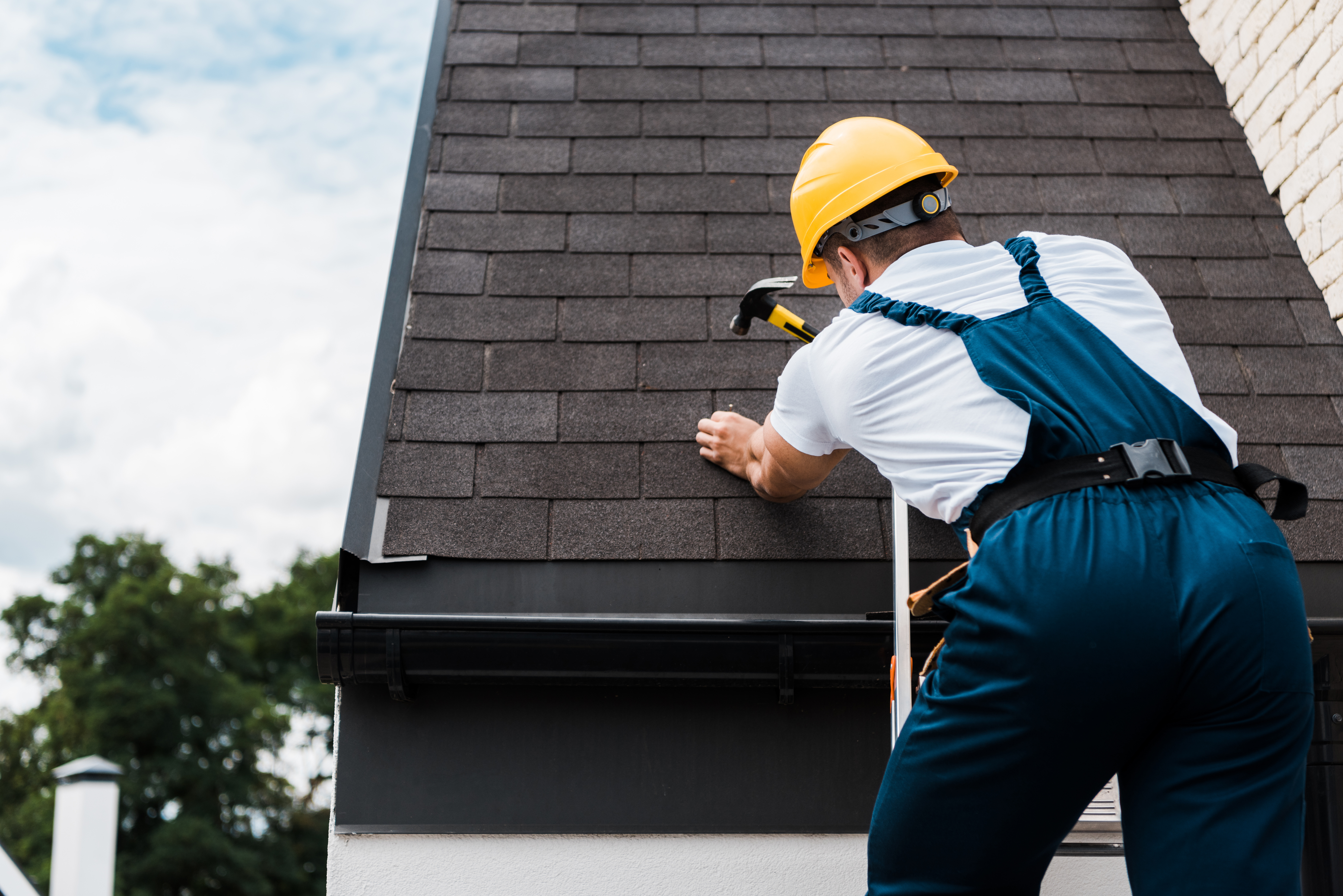 worker repairing roof