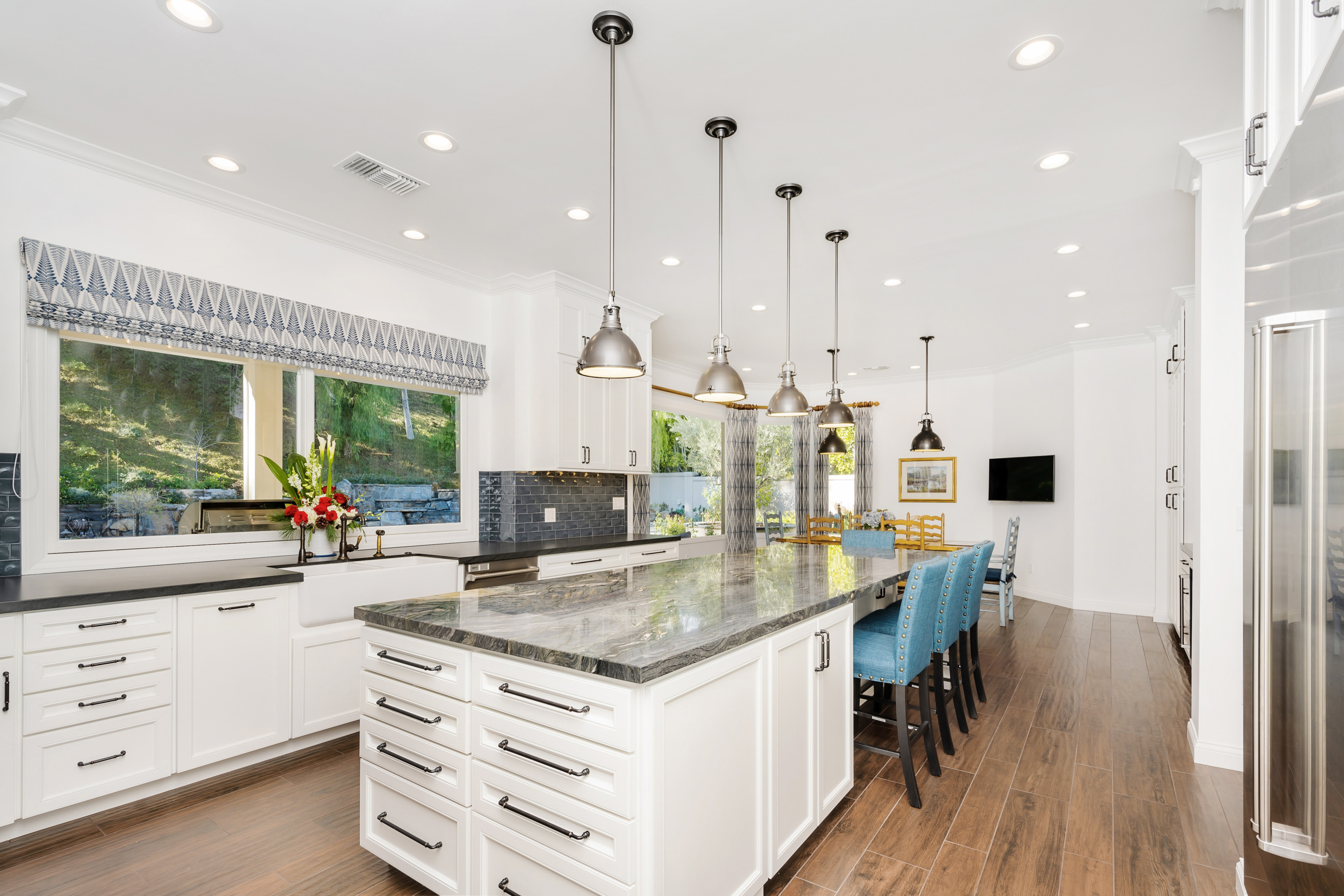 A spacious kitchen with granite countertop