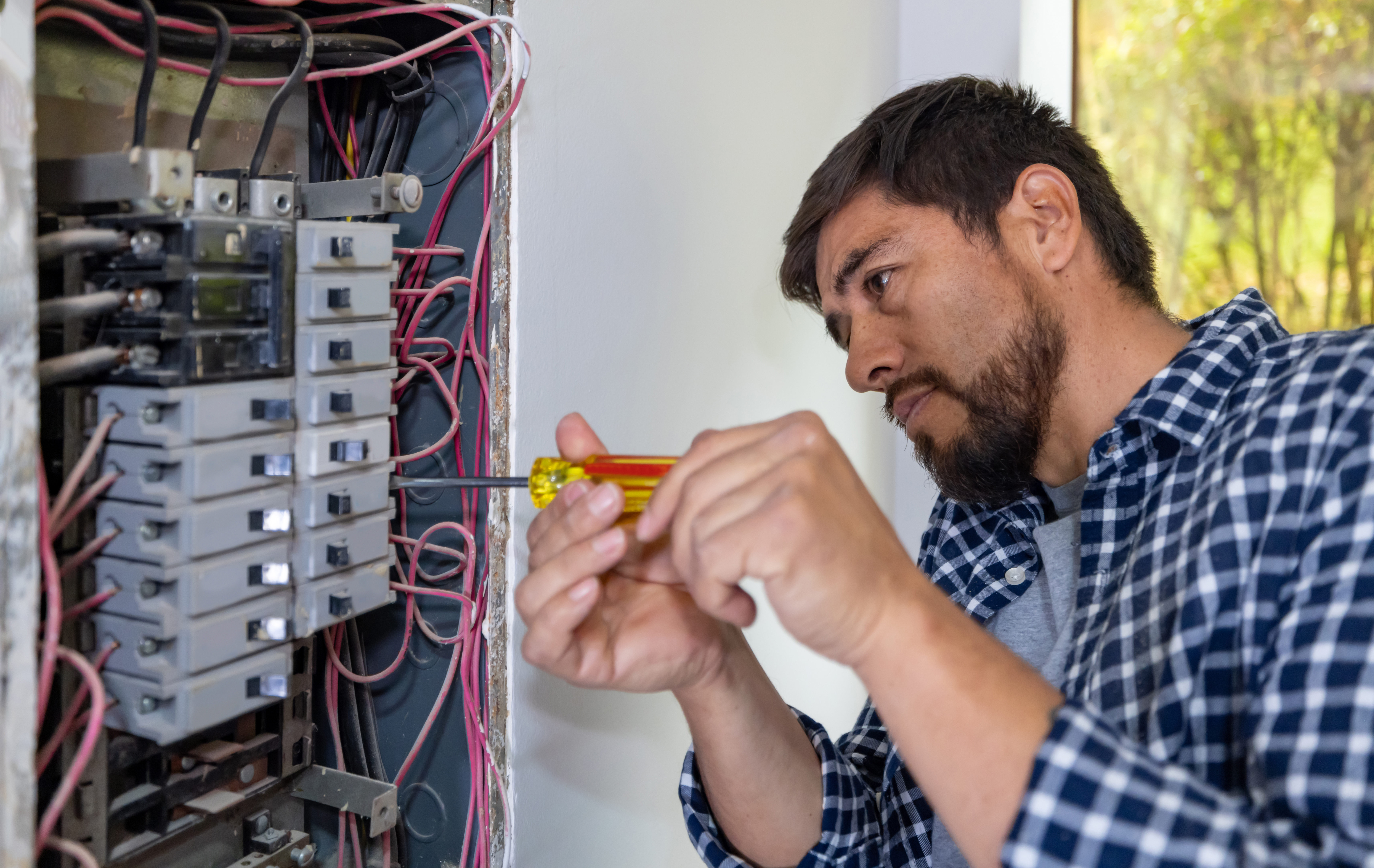 electrician fixing fuse box