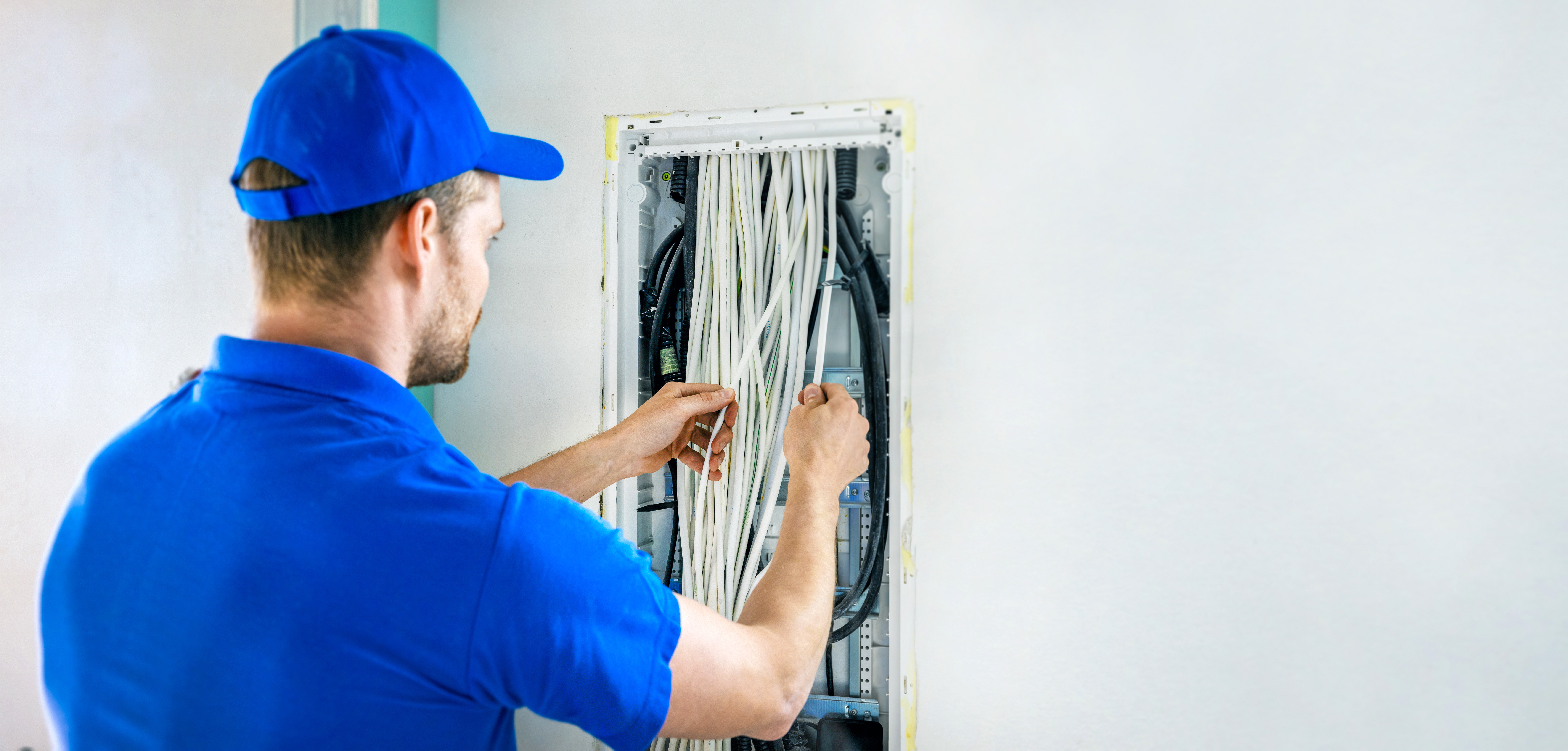 Electrician wiring a new electrical box in a house  