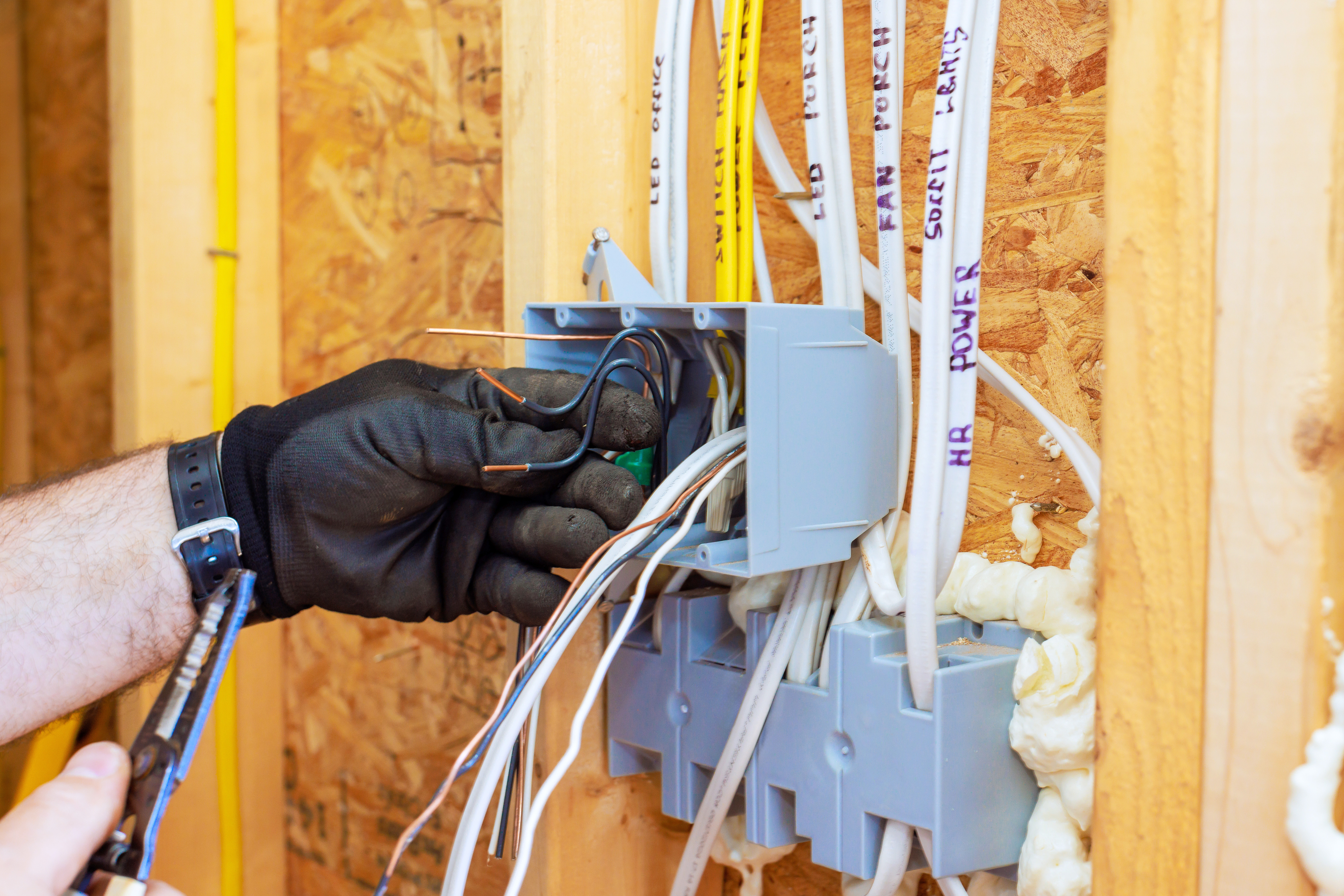 Electrician wiring a new home