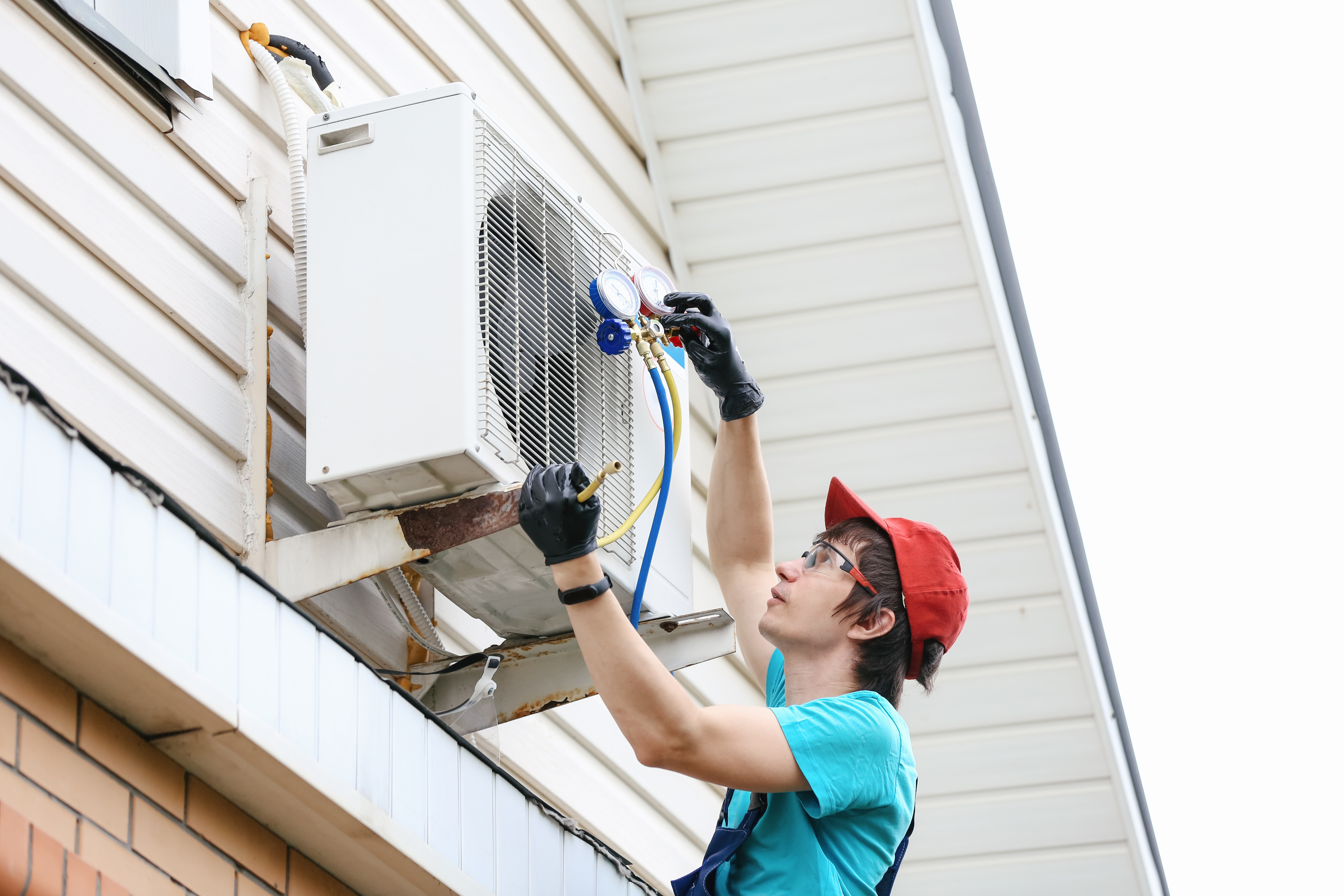 Young man working on an AC unit