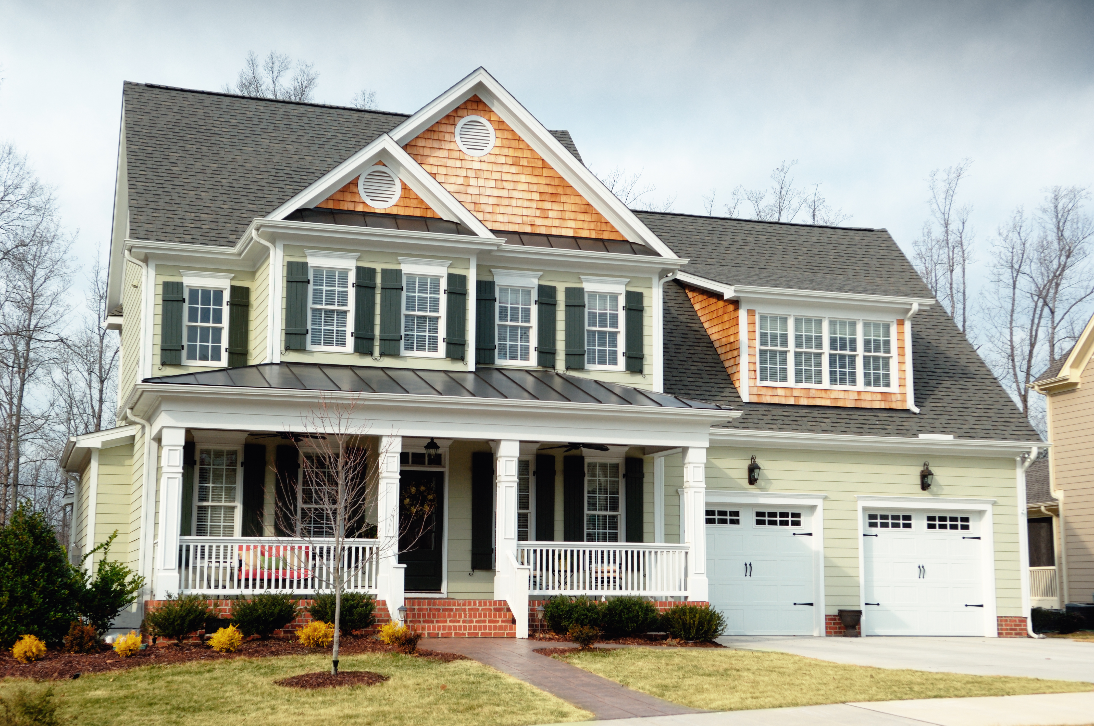 Two-story house with asphalt shingle roof and a front porch