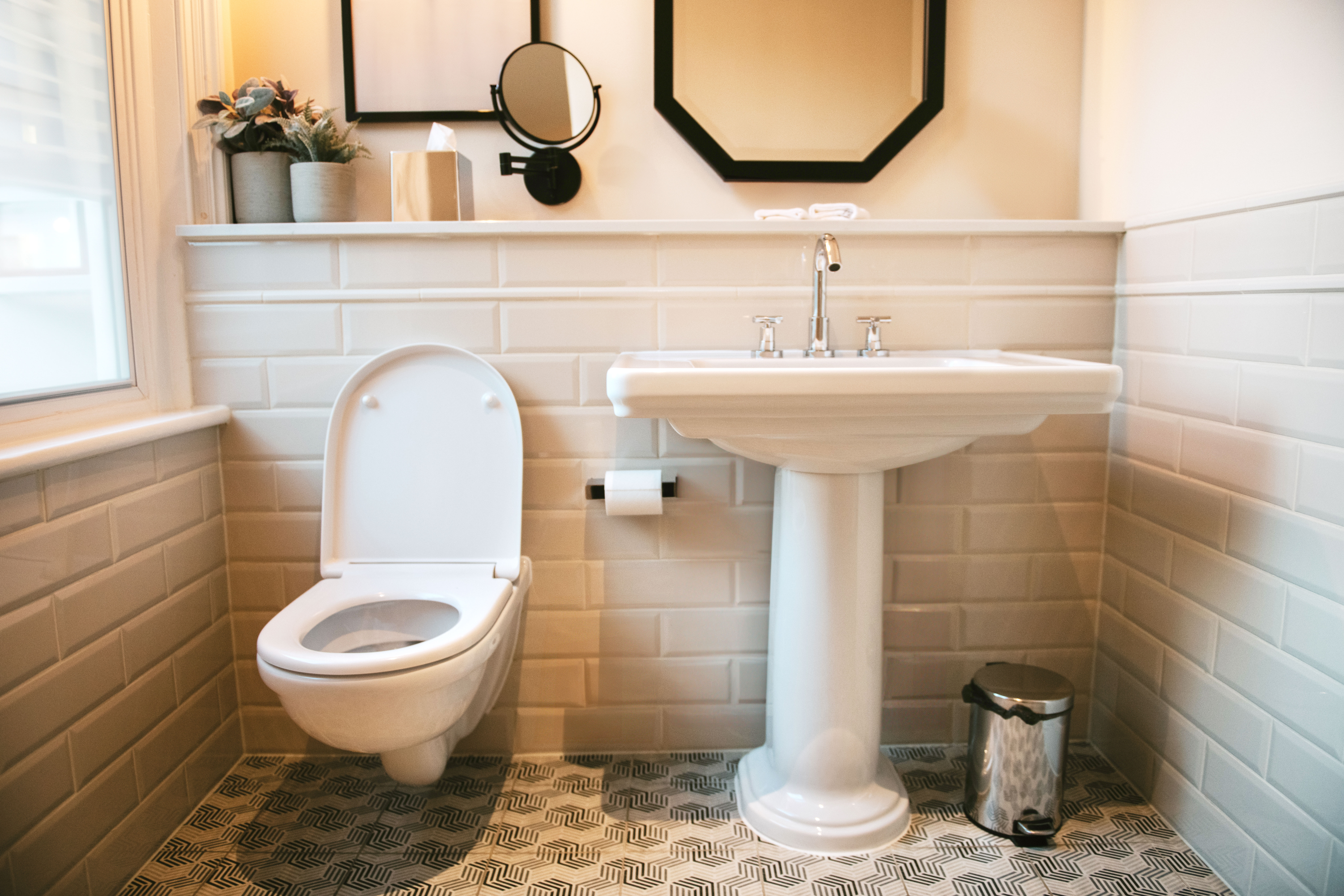 Pedestal sink installed in a small bathroom