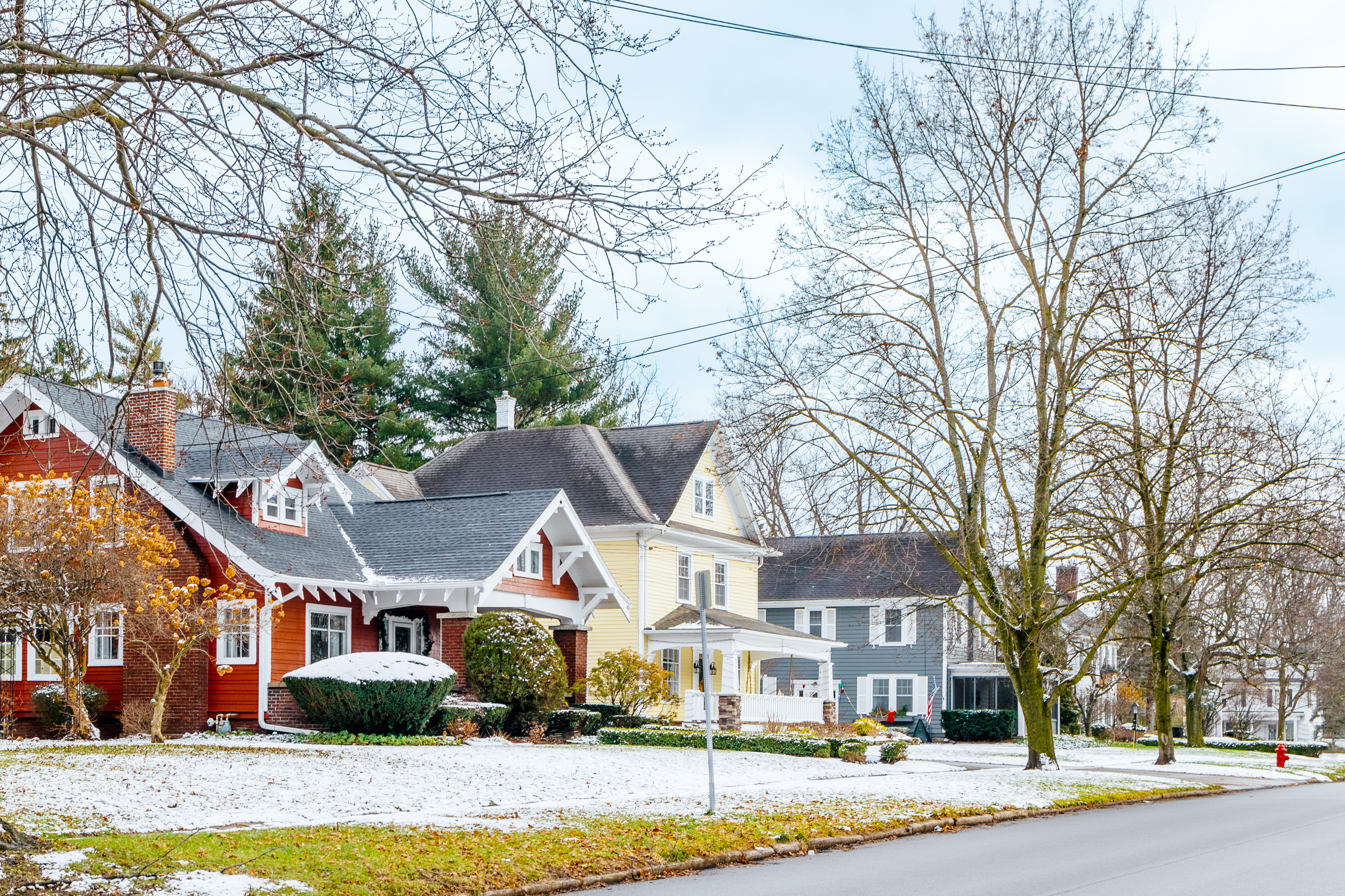 A row of houses in New York after a light dusting of snow  