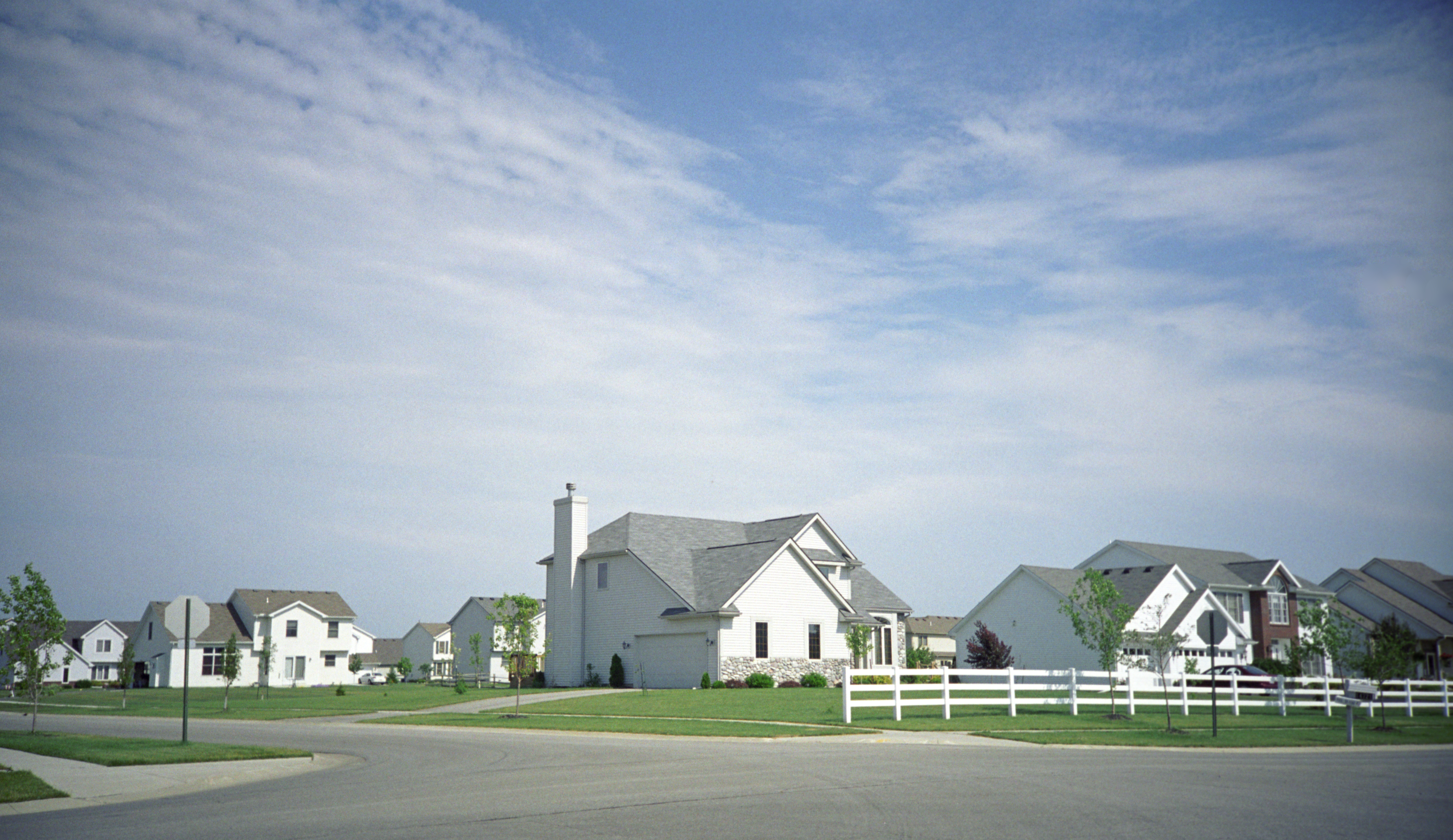 Typical houses with white picket fences