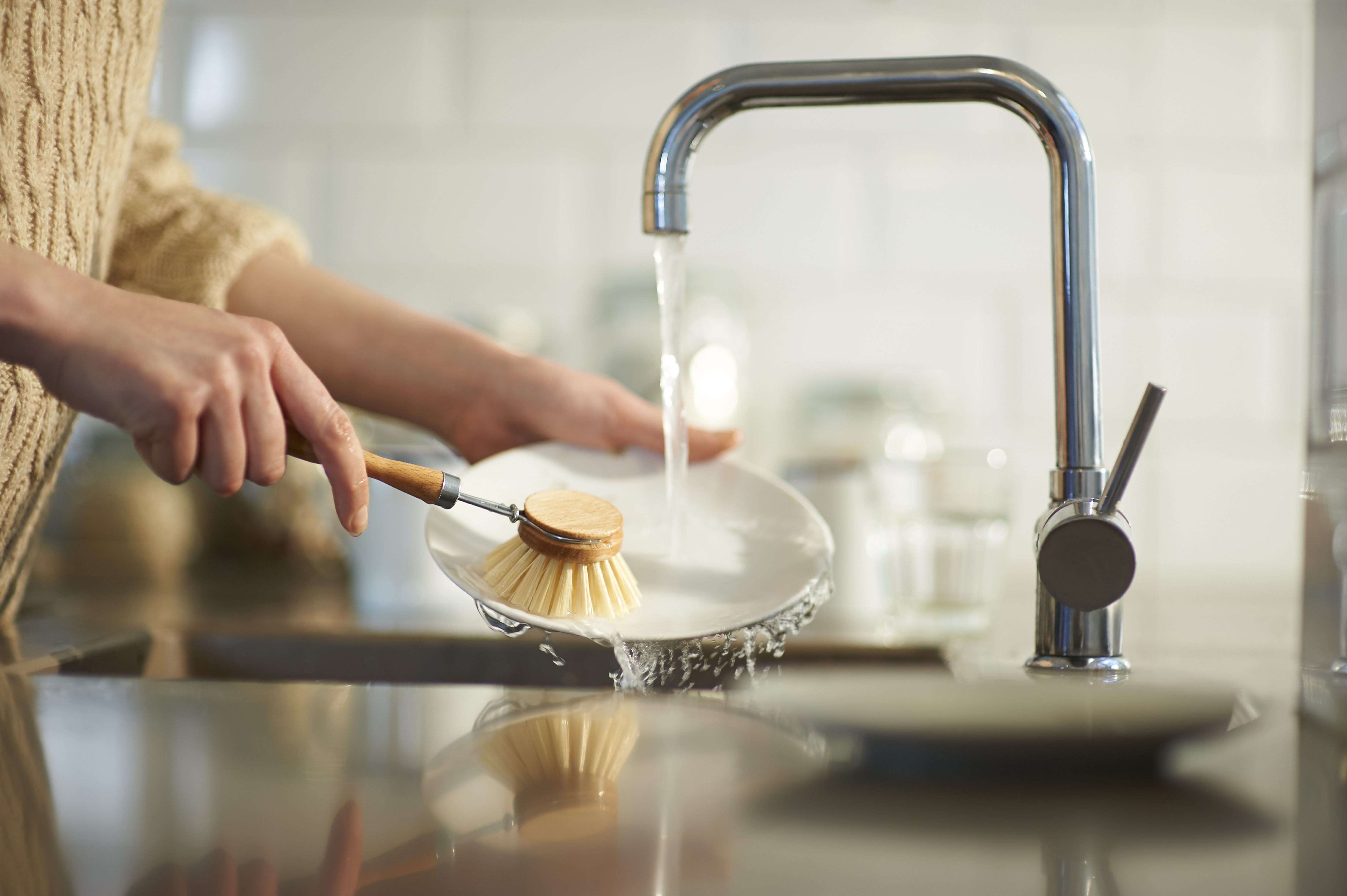Woman washing dishes