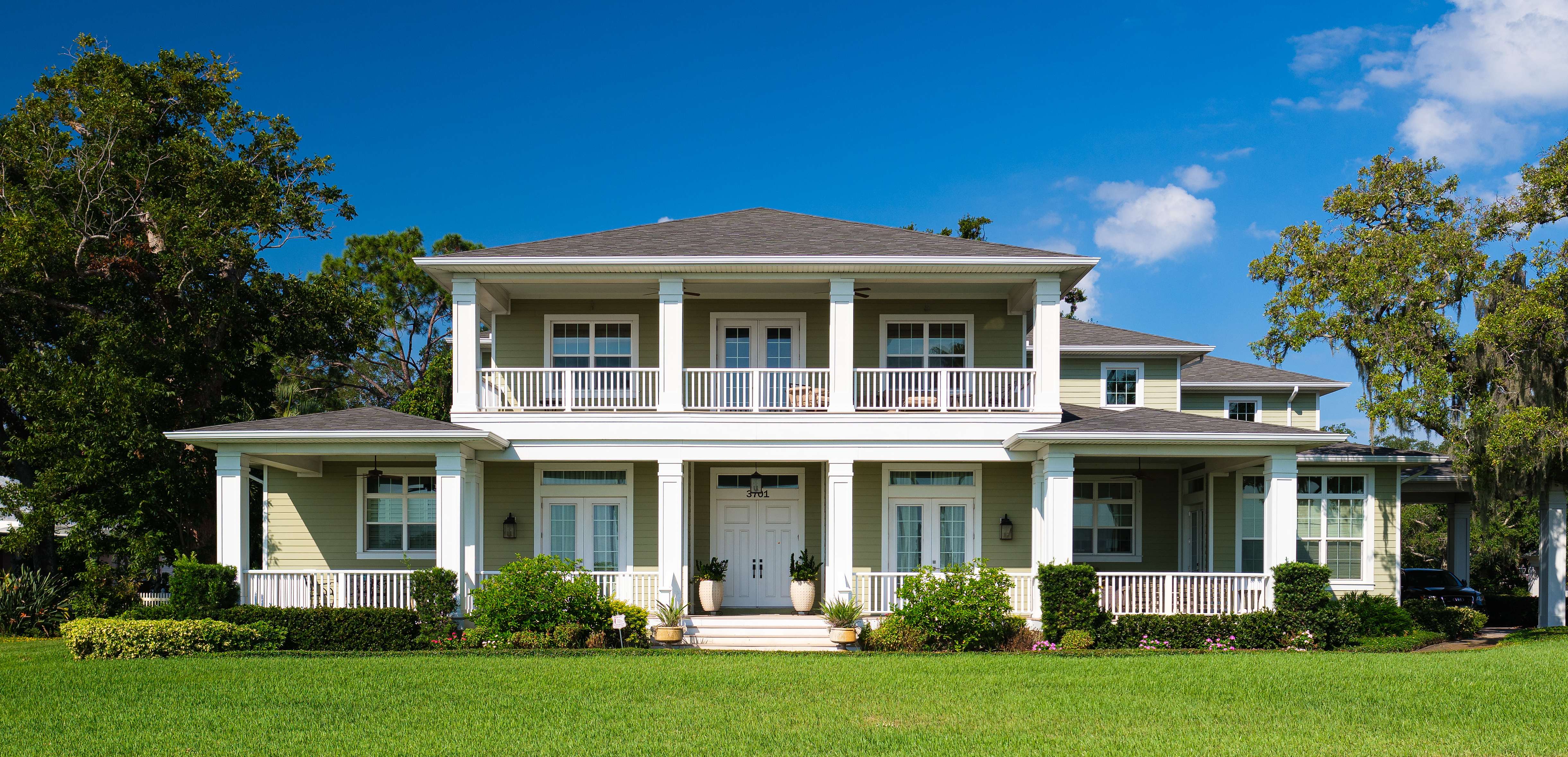 large tampa home with shingle roof