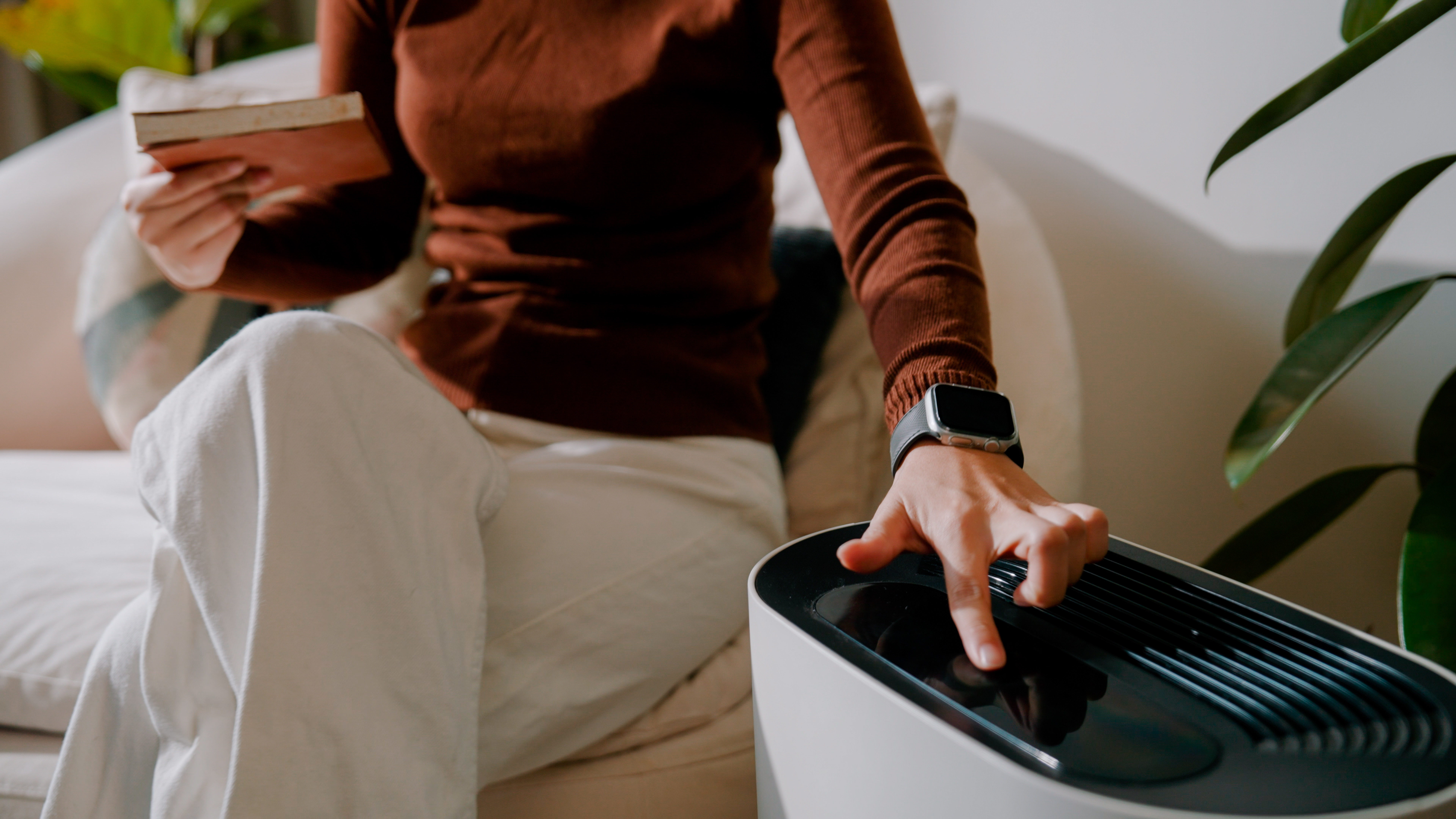 A woman operating a portable AC 