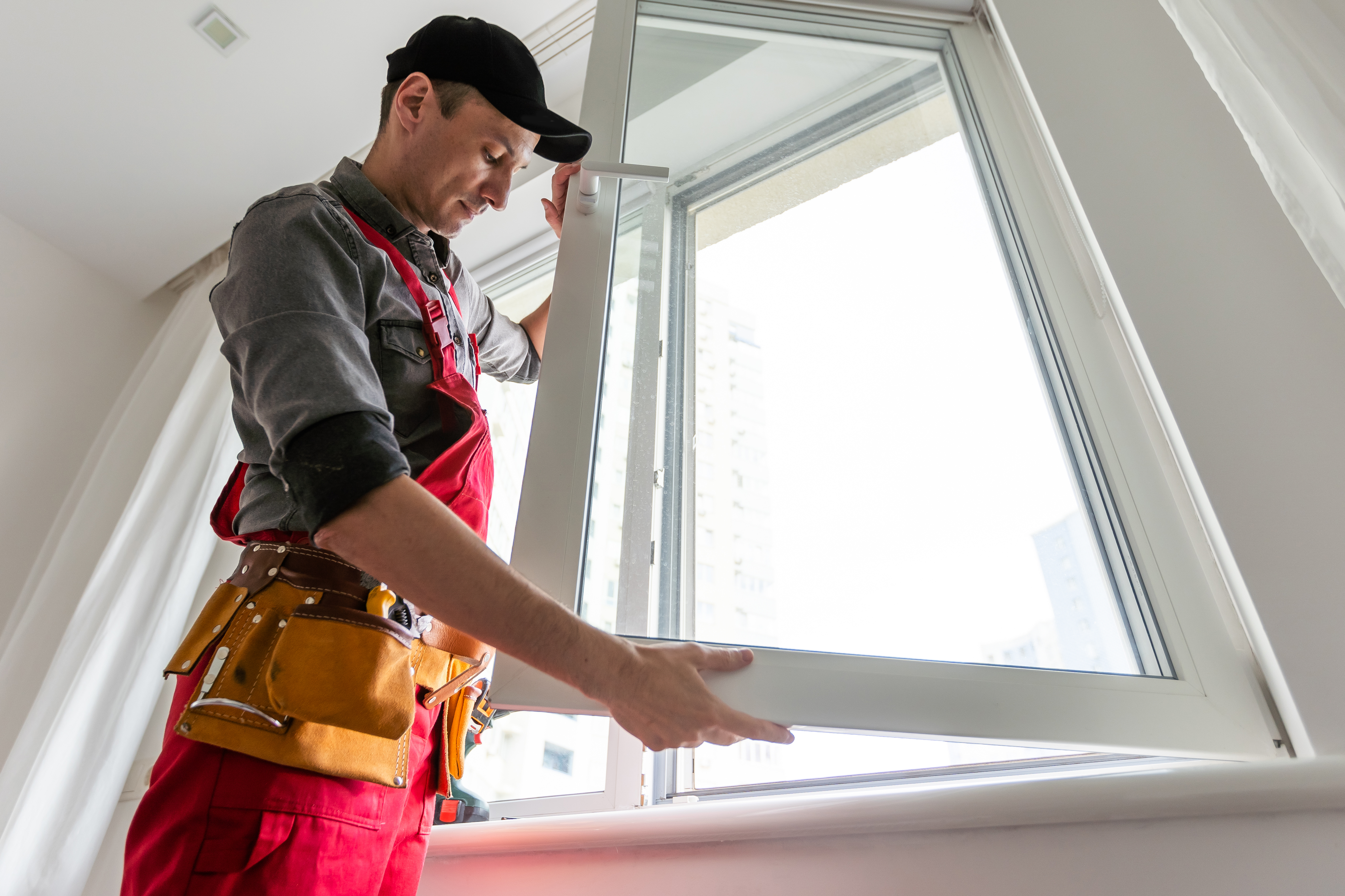 man replacing window in orlando home