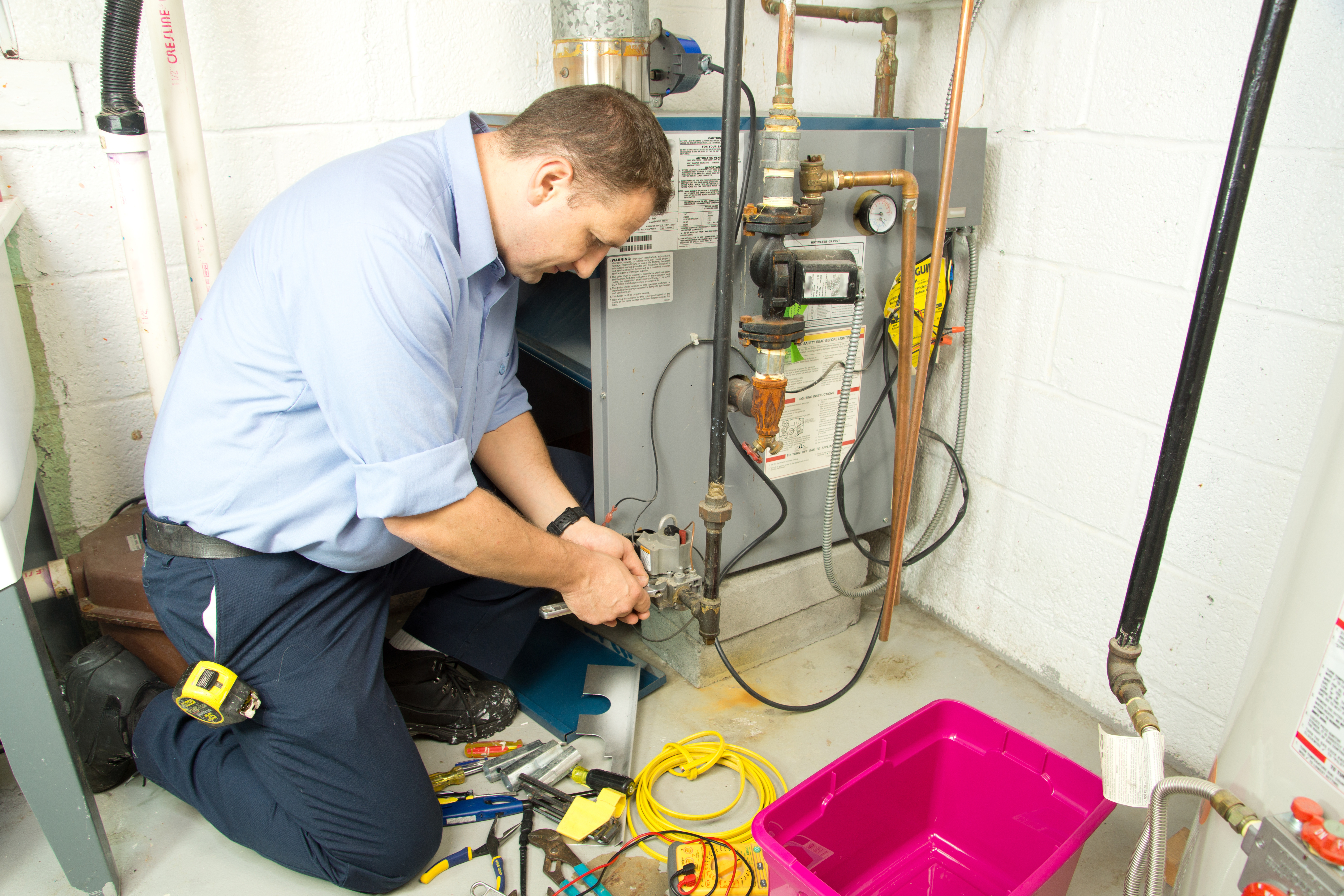 technician installing furnace