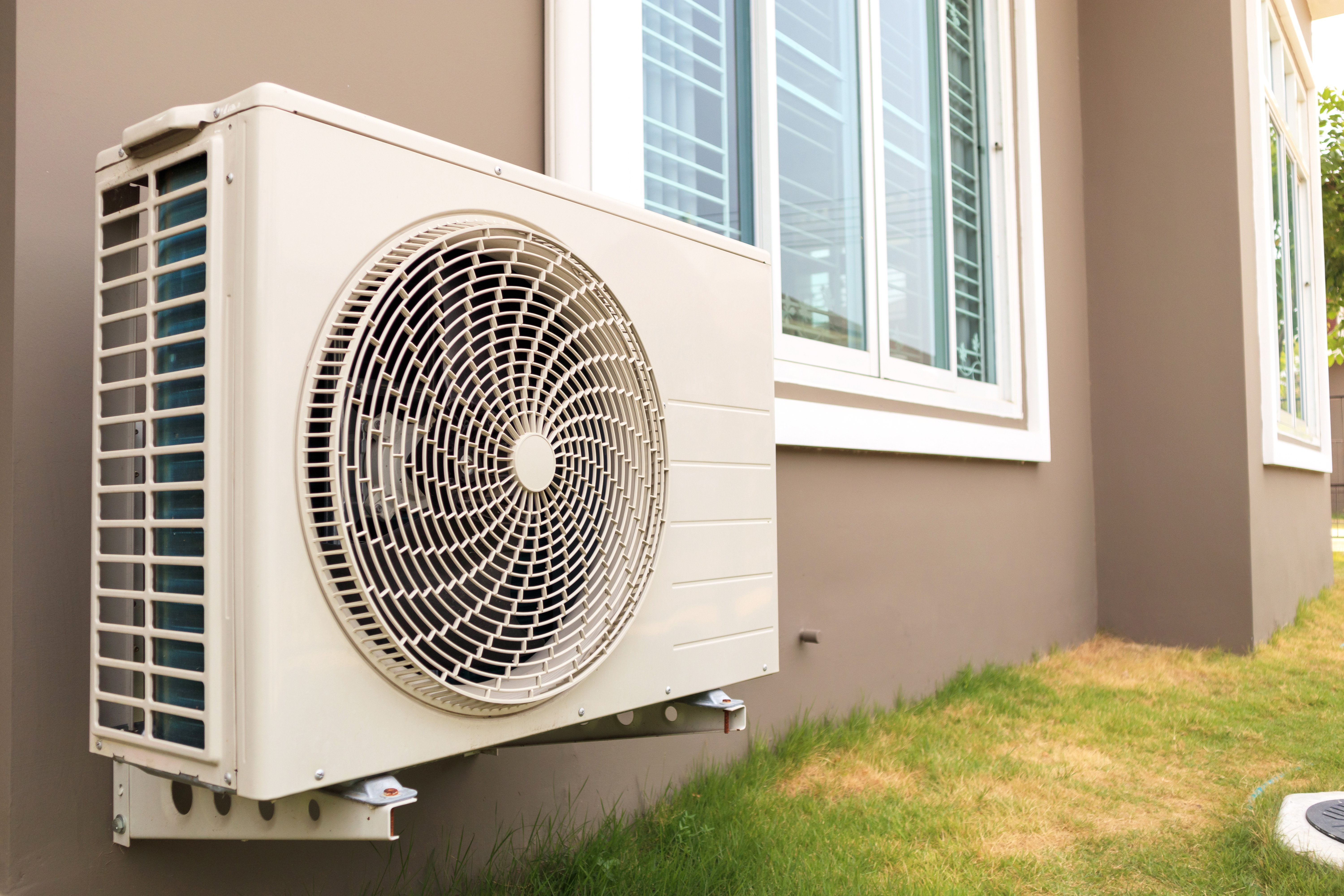 Air conditioner unit mounted on an exterior wall