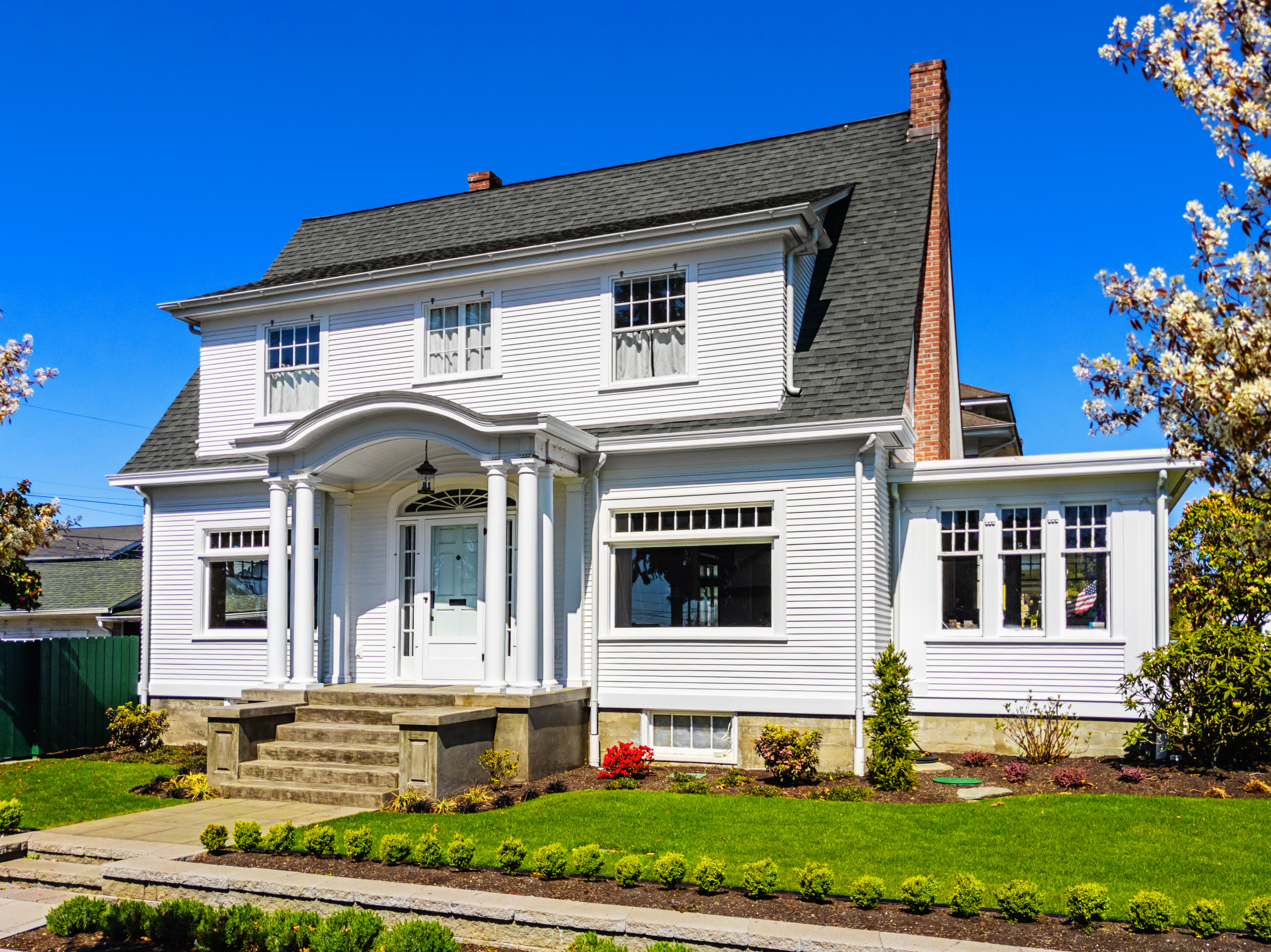 Vinyl siding installed on a colonial-style house   