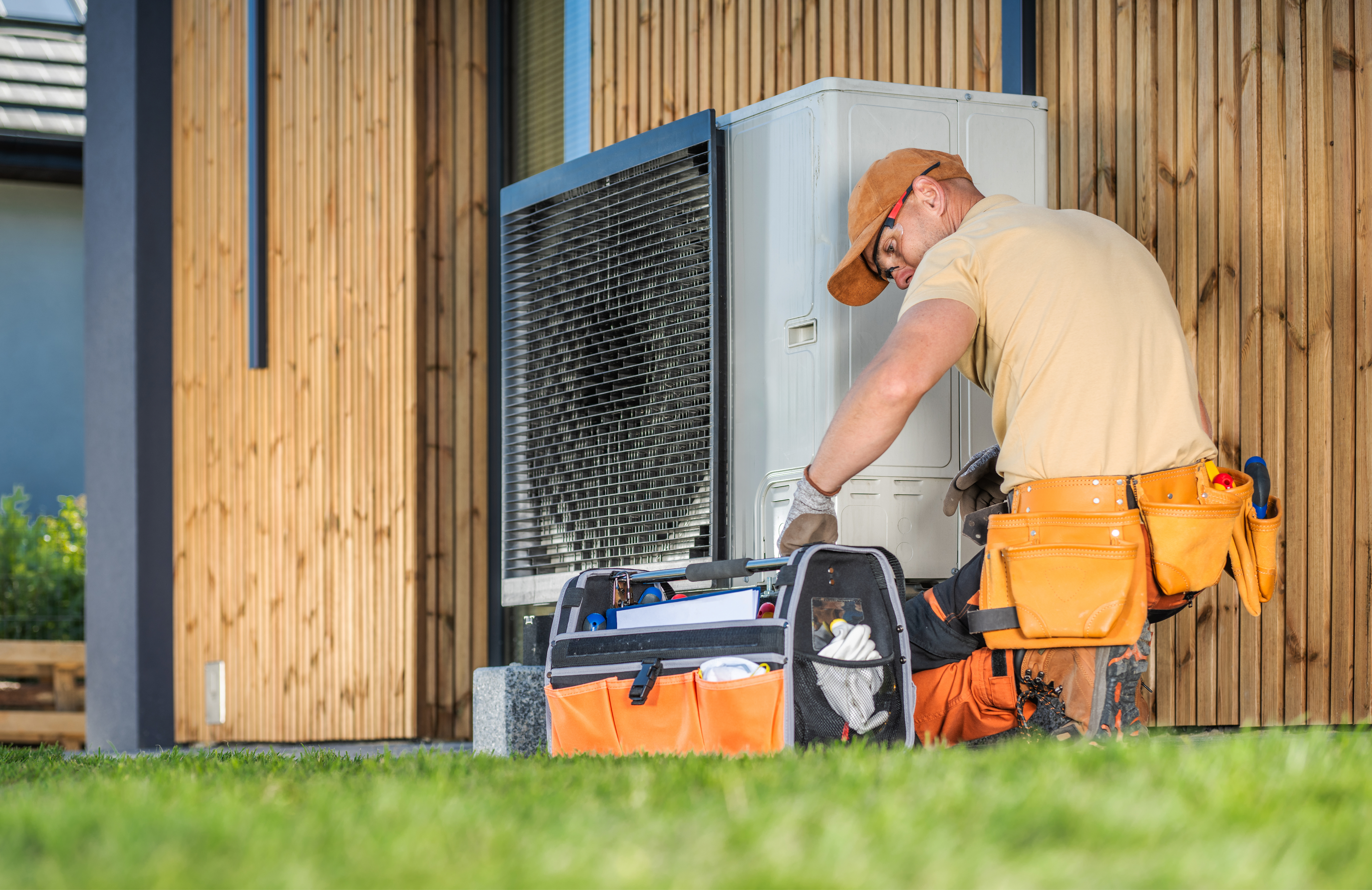 Worker fixing heat pump