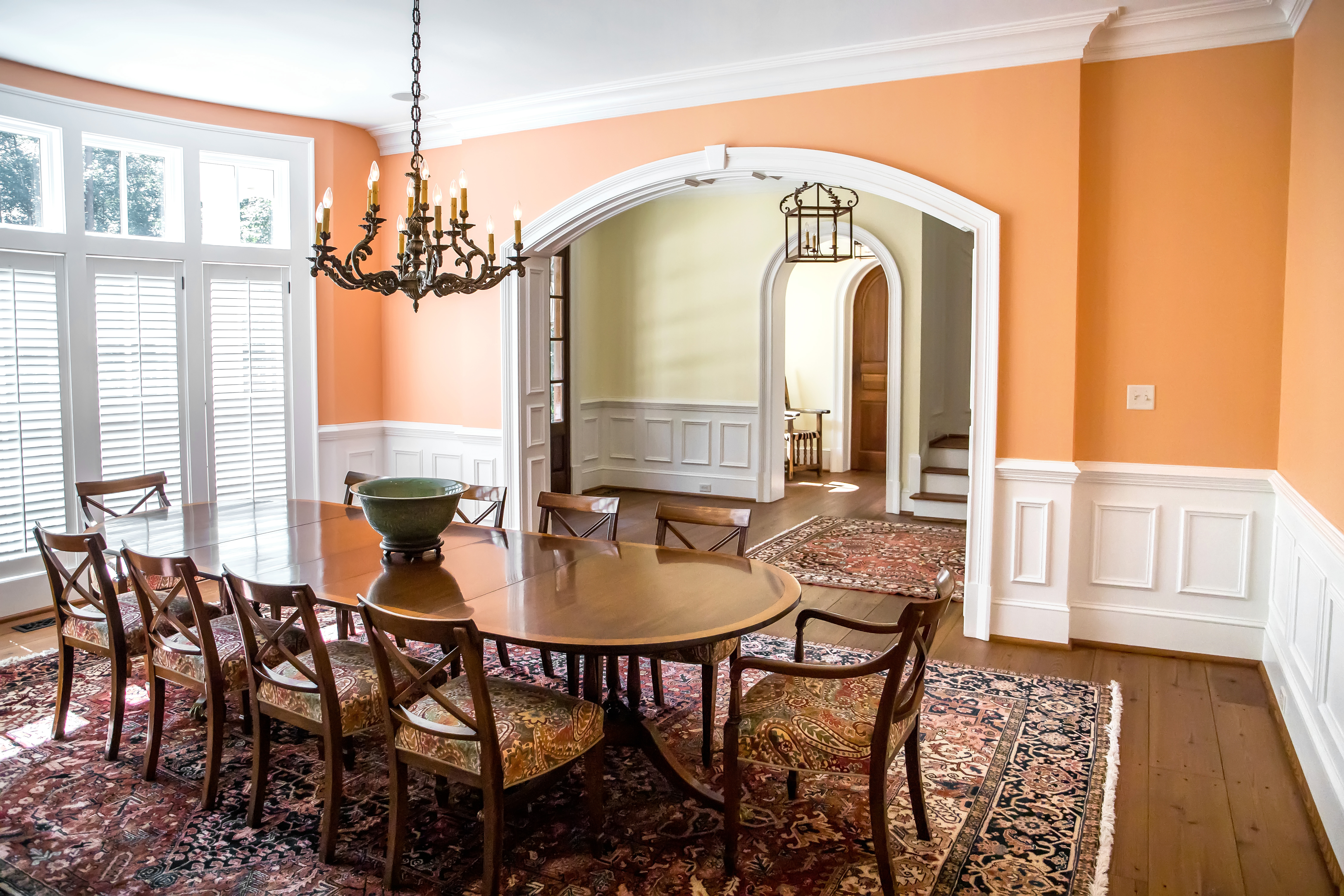 Formal dining room with crown molding and a chandelier