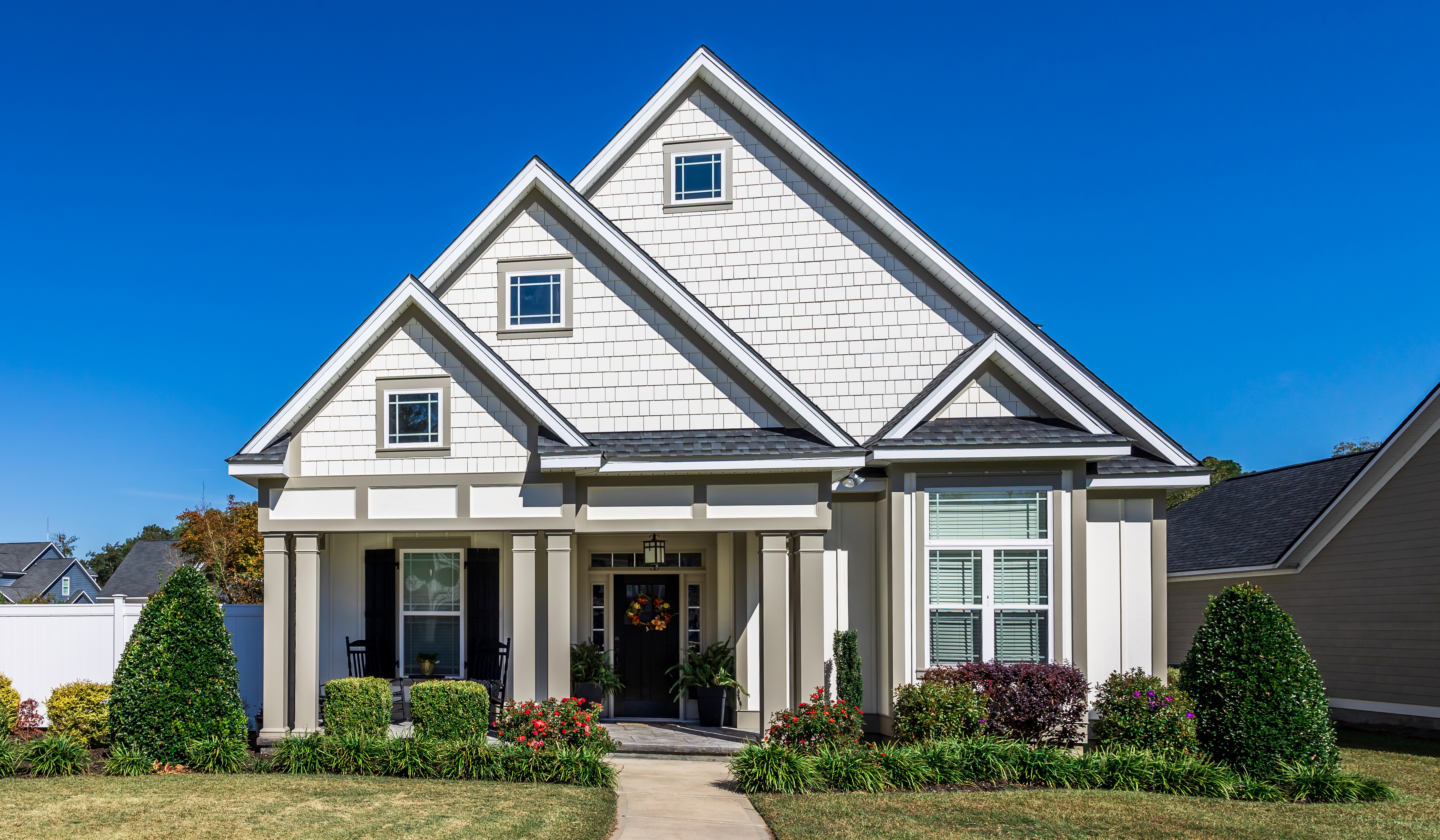 House with fiber cement siding and multi-gable roof  